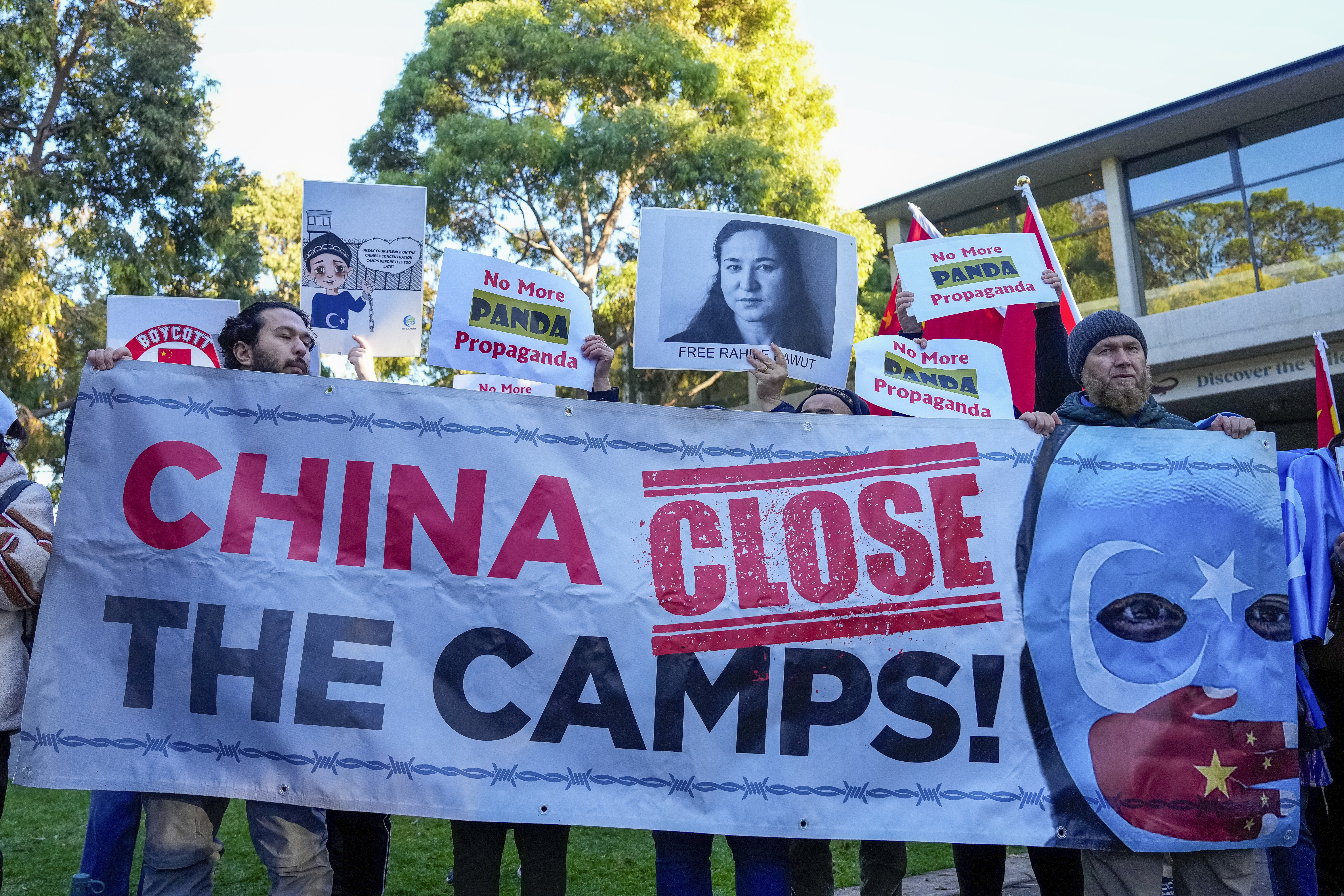 Protesters call on China to 'close the camps' in reference to Xinjiang where the UN has said at least one million mostly Muslim Uighurs have been detained in re-education centres
