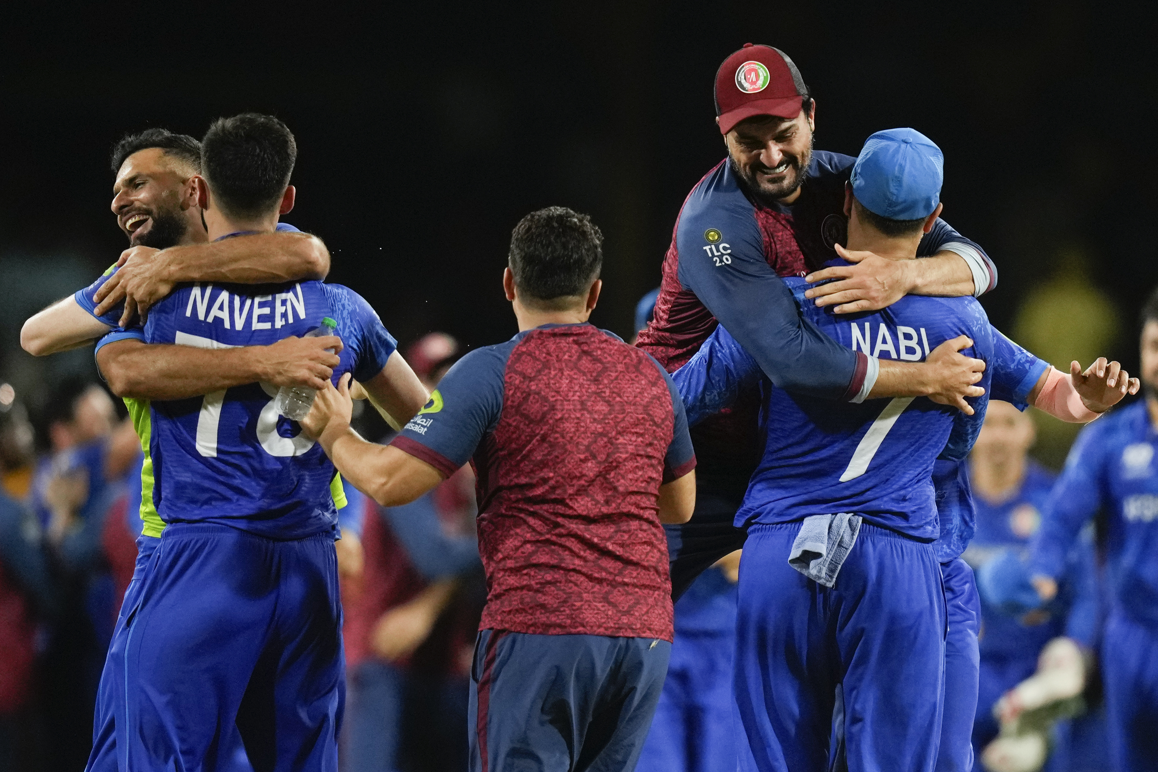 Afghanistan players celebrate after defeating Australia by 21 runs in their men's T20 World Cup cricket match at Arnos Vale Ground, Kingstown, Saint Vincent and the Grenadines, Saturday, June 22, 2024. (AP Photo/Ramon Espinosa)