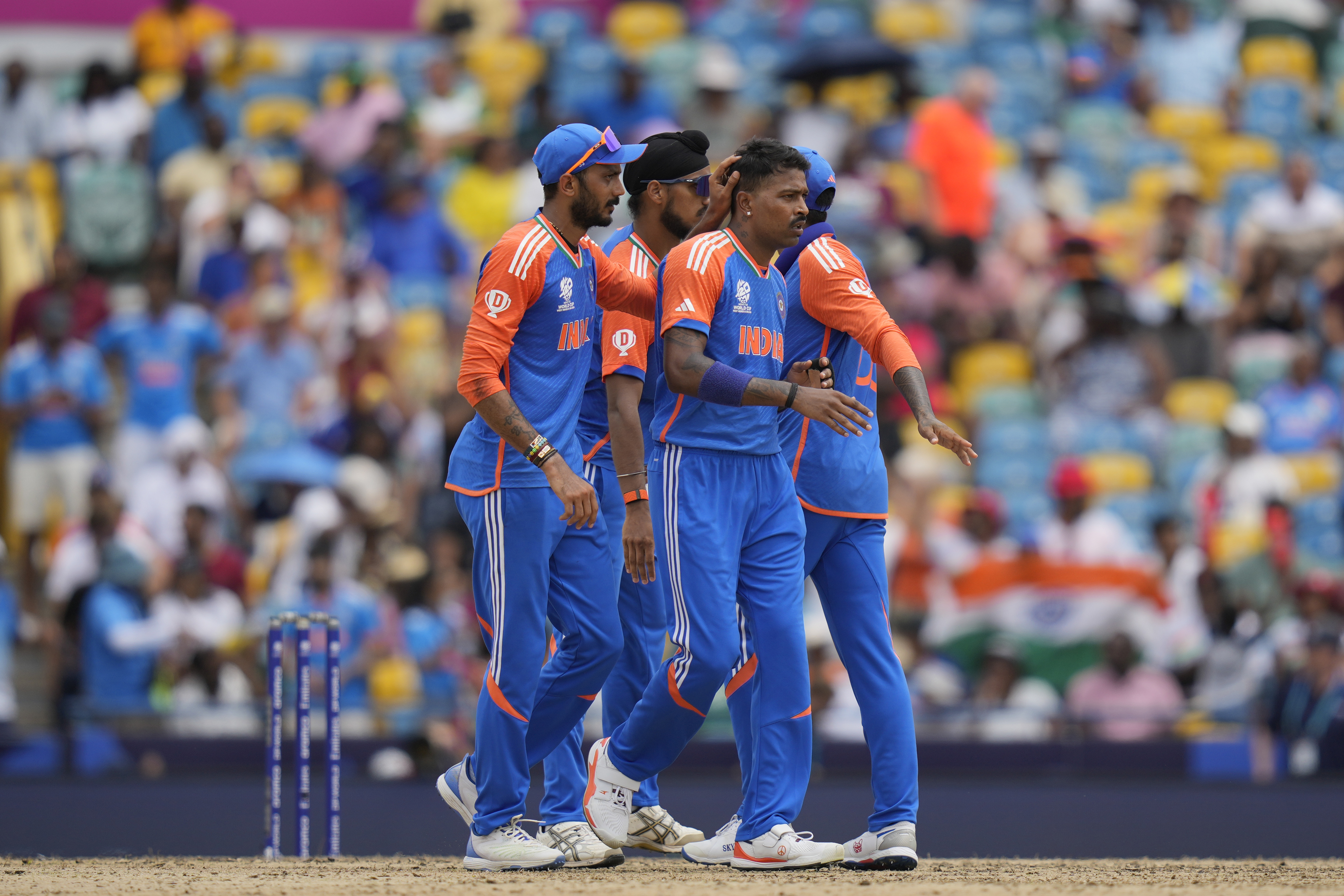 India's Hardik Pandya, second right, is congratulated by teammates after taking the wicket of South Africa's Heinrich Klaasen during the ICC Men's T20 World Cup final cricket match between India and South Africa at Kensington Oval in Bridgetown, Barbados, Saturday, June 29, 2024. (AP Photo/Ramon Espinosa)