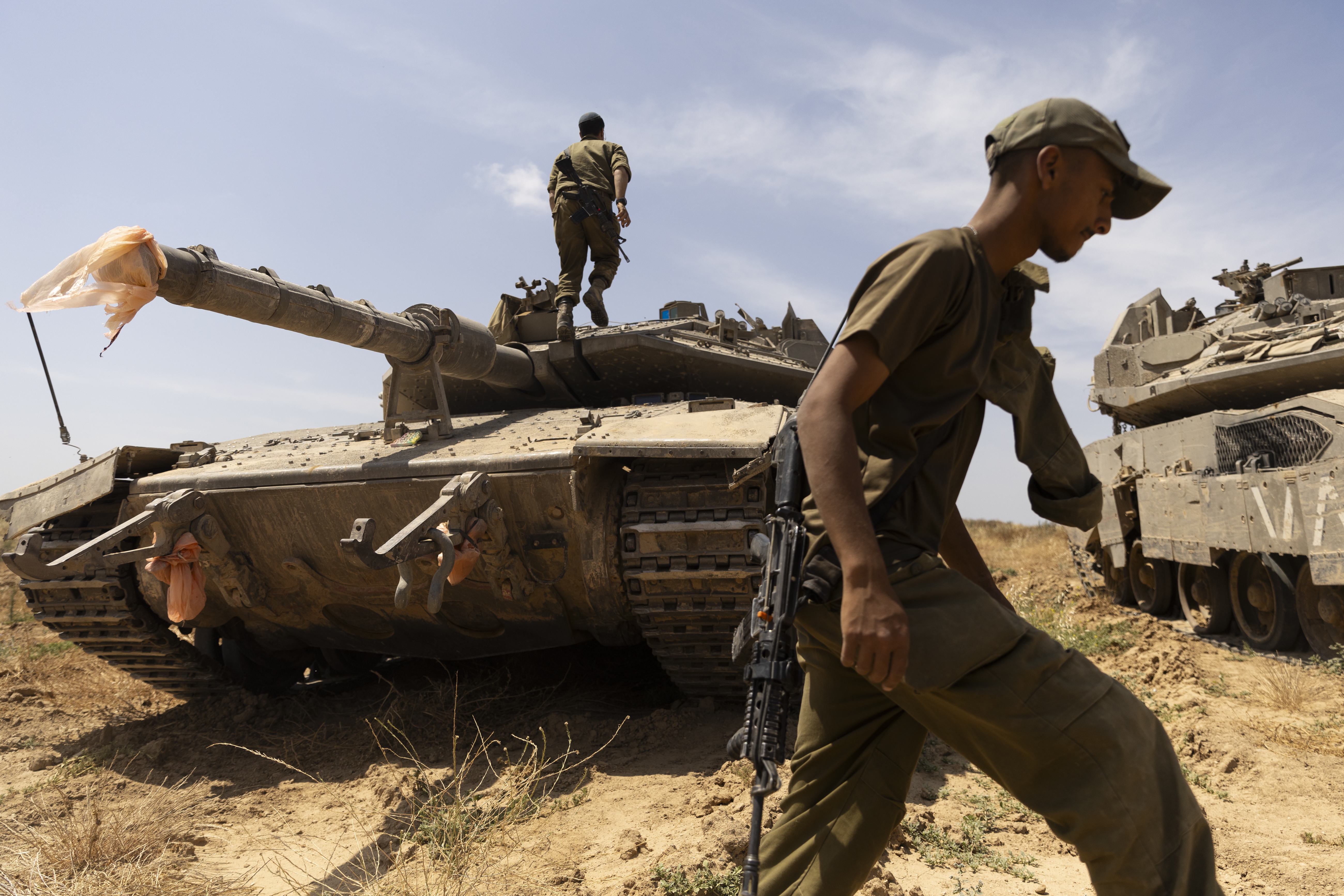 Israeli soldiers prepare a tank near the border with the southern Gaza Strip on May 2, 2024