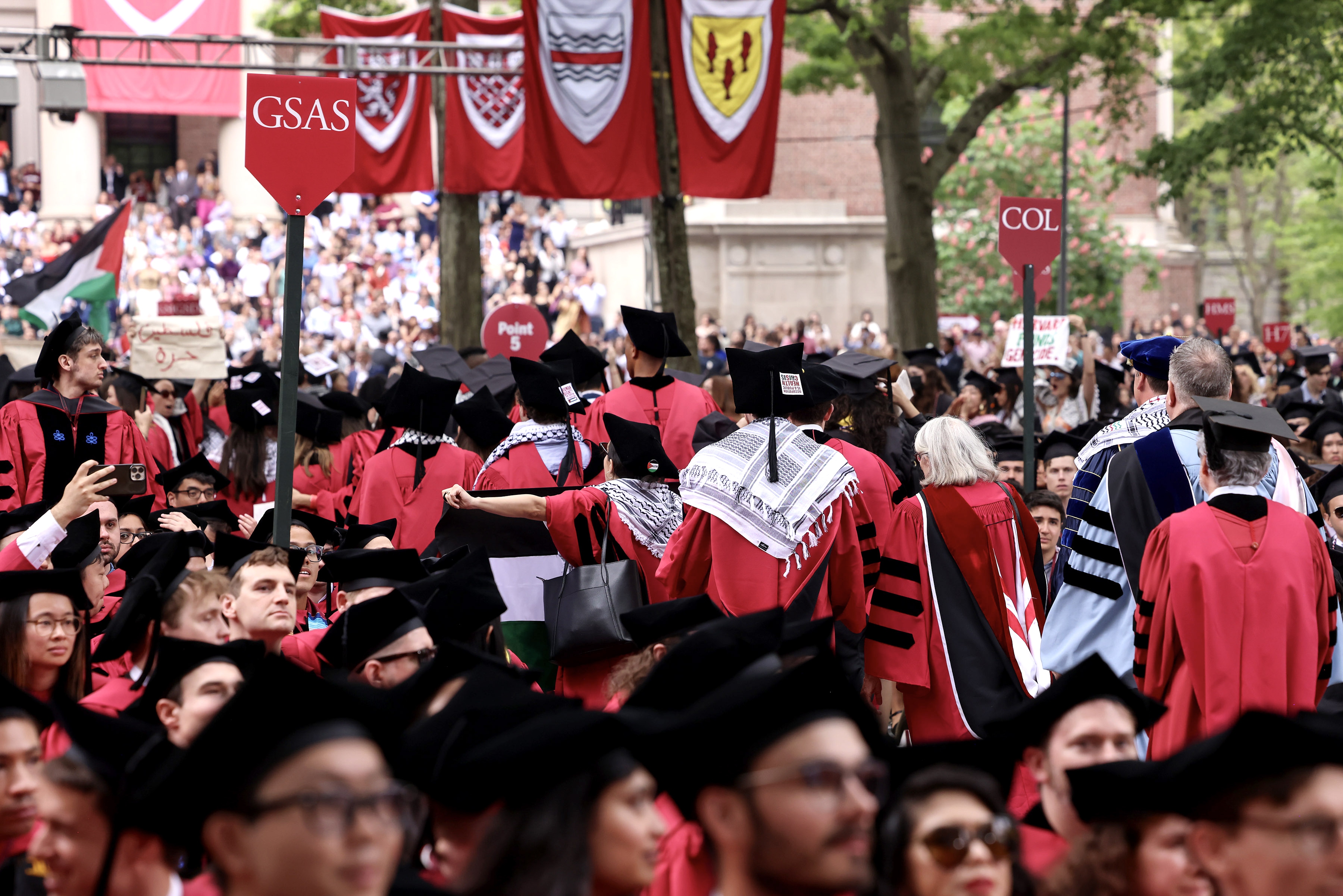 More than a thousand students, faculty members and other participants walked out of Harvard's Commencement ceremony last month. [Mark Stockwell/EPA]