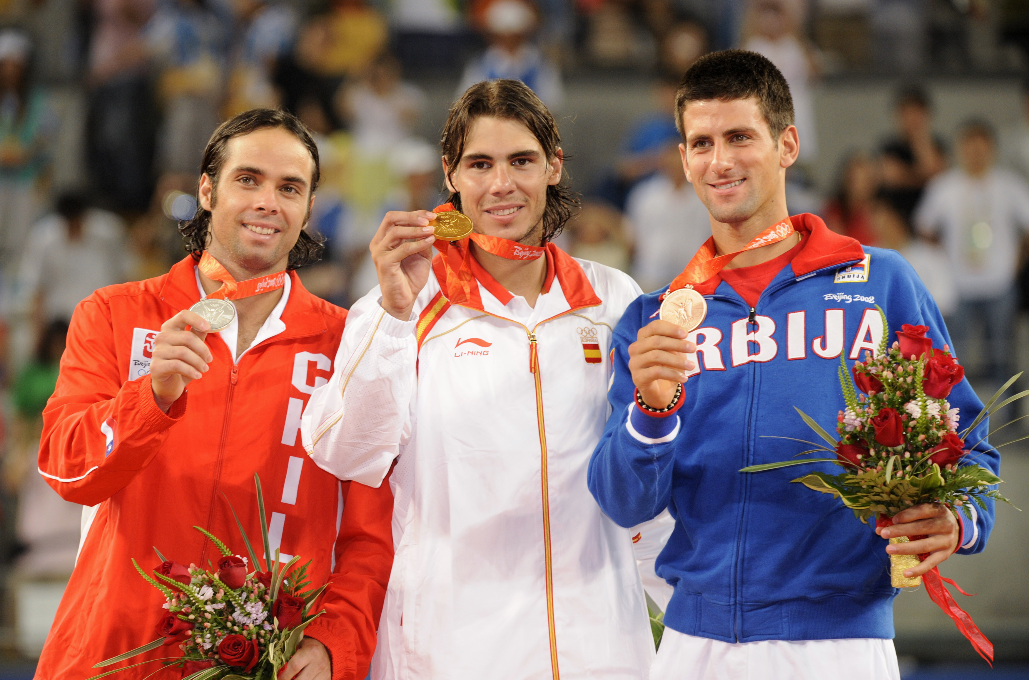 Gold medallist Rafael Nadal of Spain (C), silver medallist Fernando Gonzales of Chile (R) and bronze medallist Novak Djokovic of Serbia hold their medals on the podium during the ceremony after the men's singles tennis competition at the Beijing 2008 Olympic Games August 17, 2008. REUTERS/Toby Melville (CHINA)