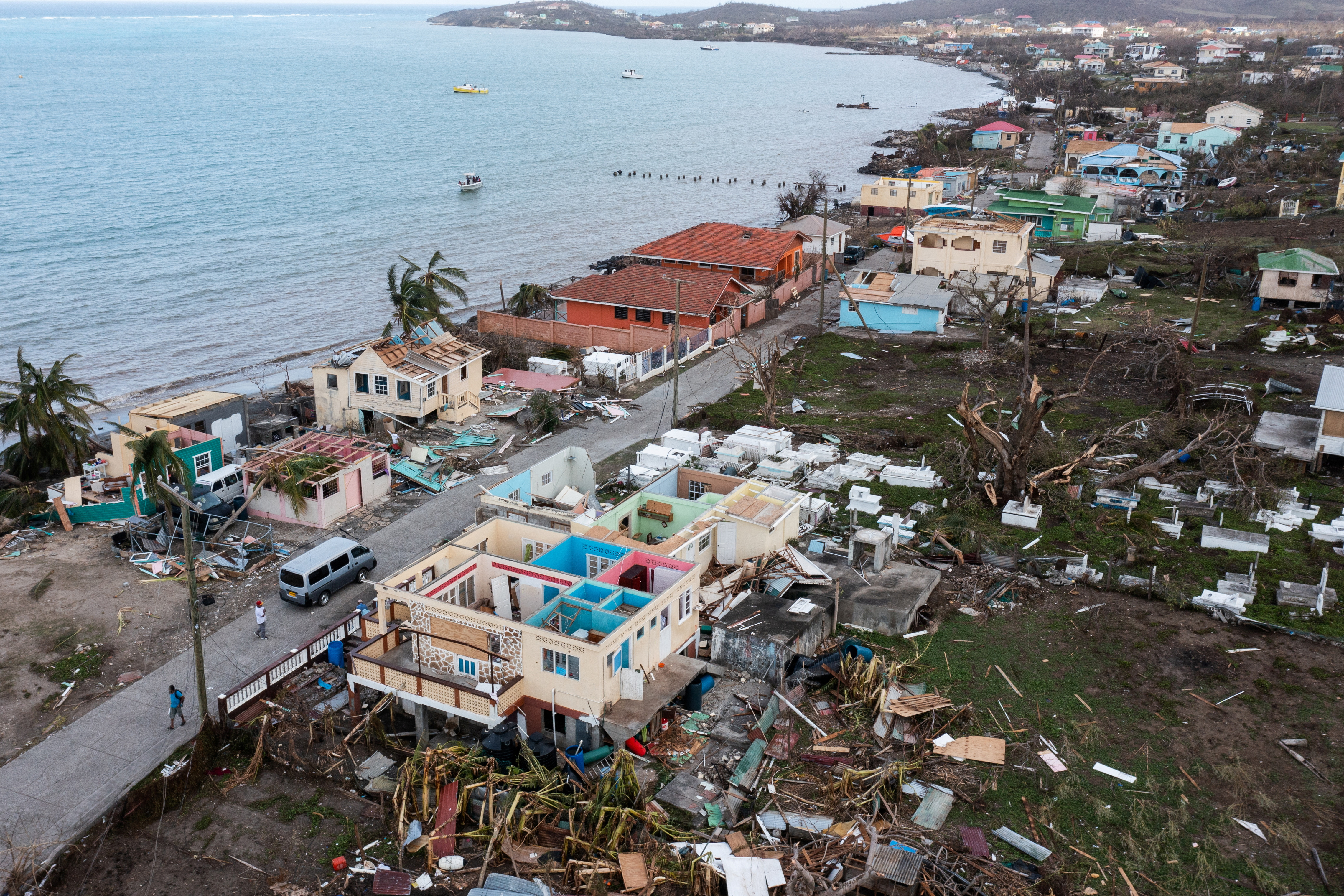 Damaged houses and building along the shore are seen in a drone photograph after the passage of Hurricane Beryl, on the island of Carriacou