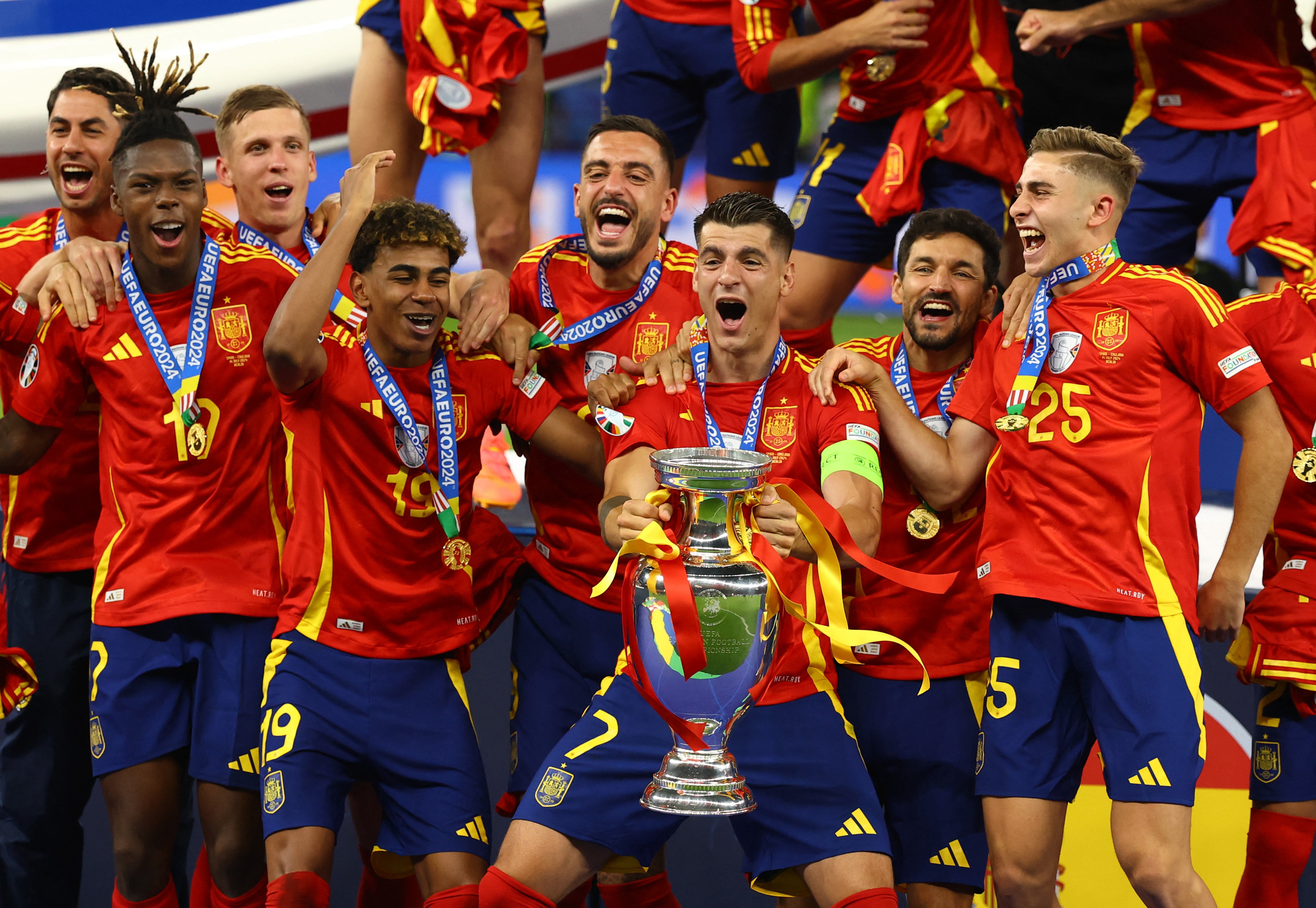 Soccer Football - Euro 2024 - Final - Spain v England - Berlin Olympiastadion, Berlin, Germany - July 14, 2024 Spain's Alvaro Morata lifts the trophy as they celebrate after victory REUTERS/Kai Pfaffenbach