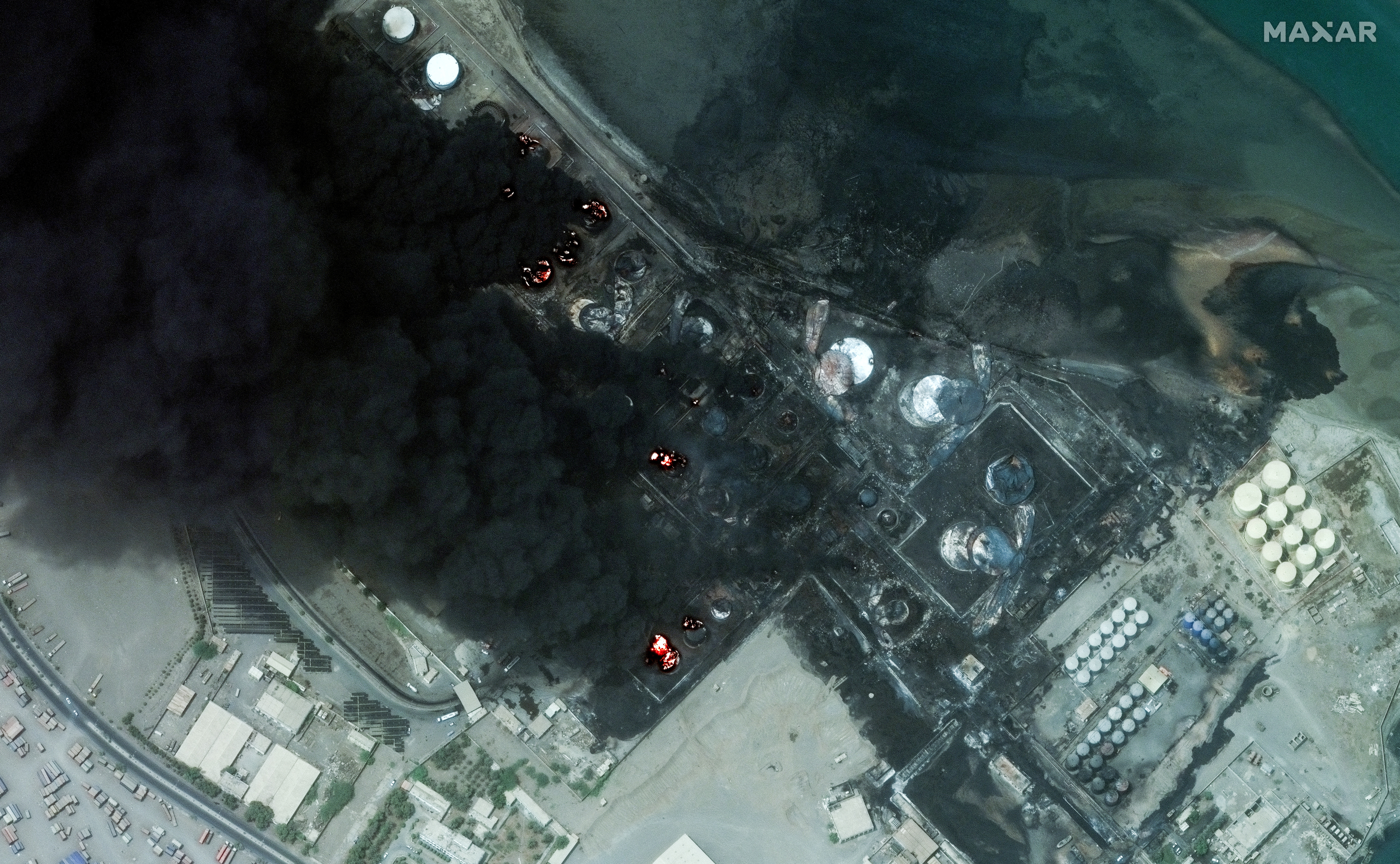 A satellite image shows a closer view of burning oil tanks after an Israeli air strike on Houthi military targets in Hodeidah, Yemen