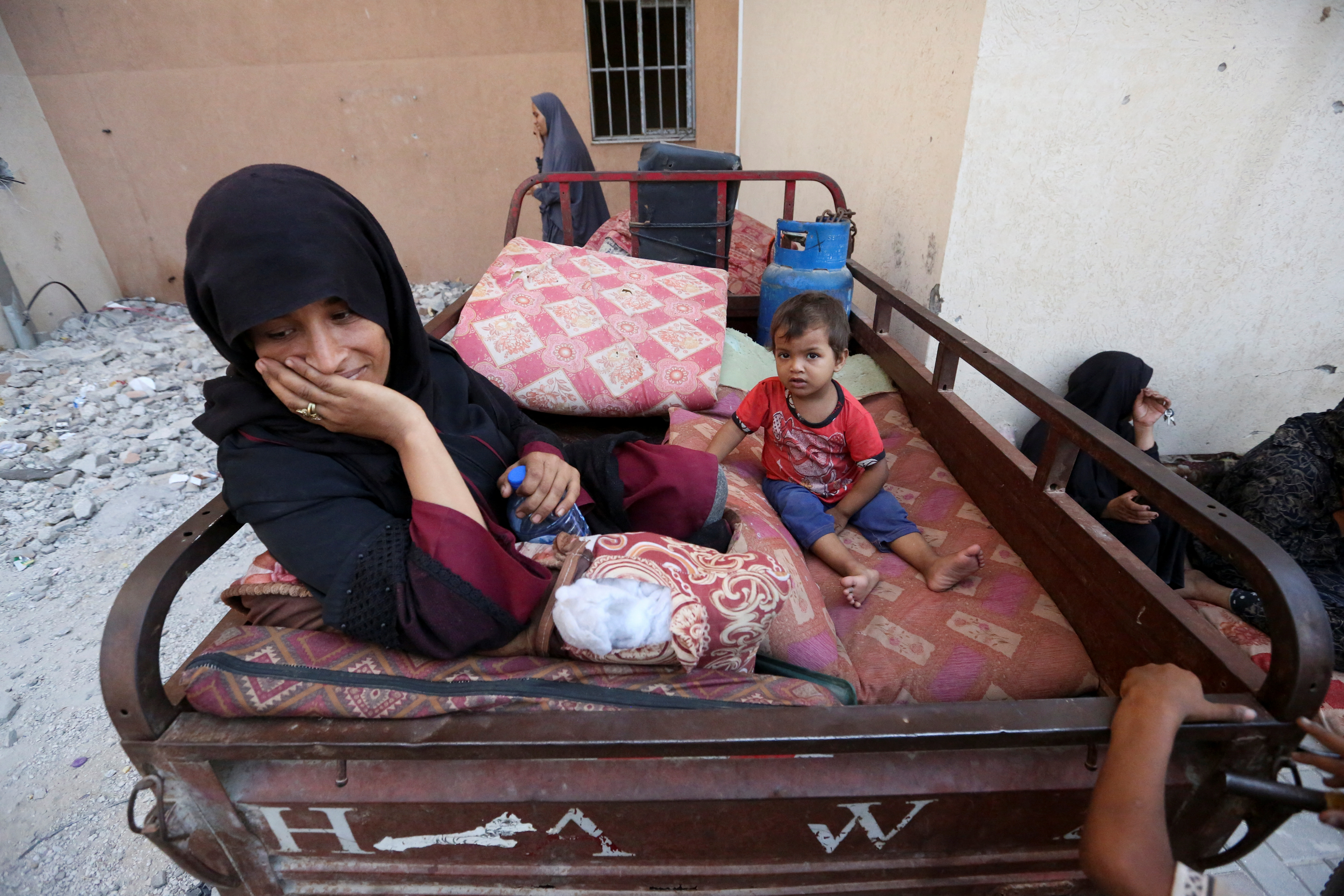 Displaced Palestinians, who fled their houses due to Israeli strikes, take shelter, amid the ongoing conflict between Israel and Hamas, in Khan Younis