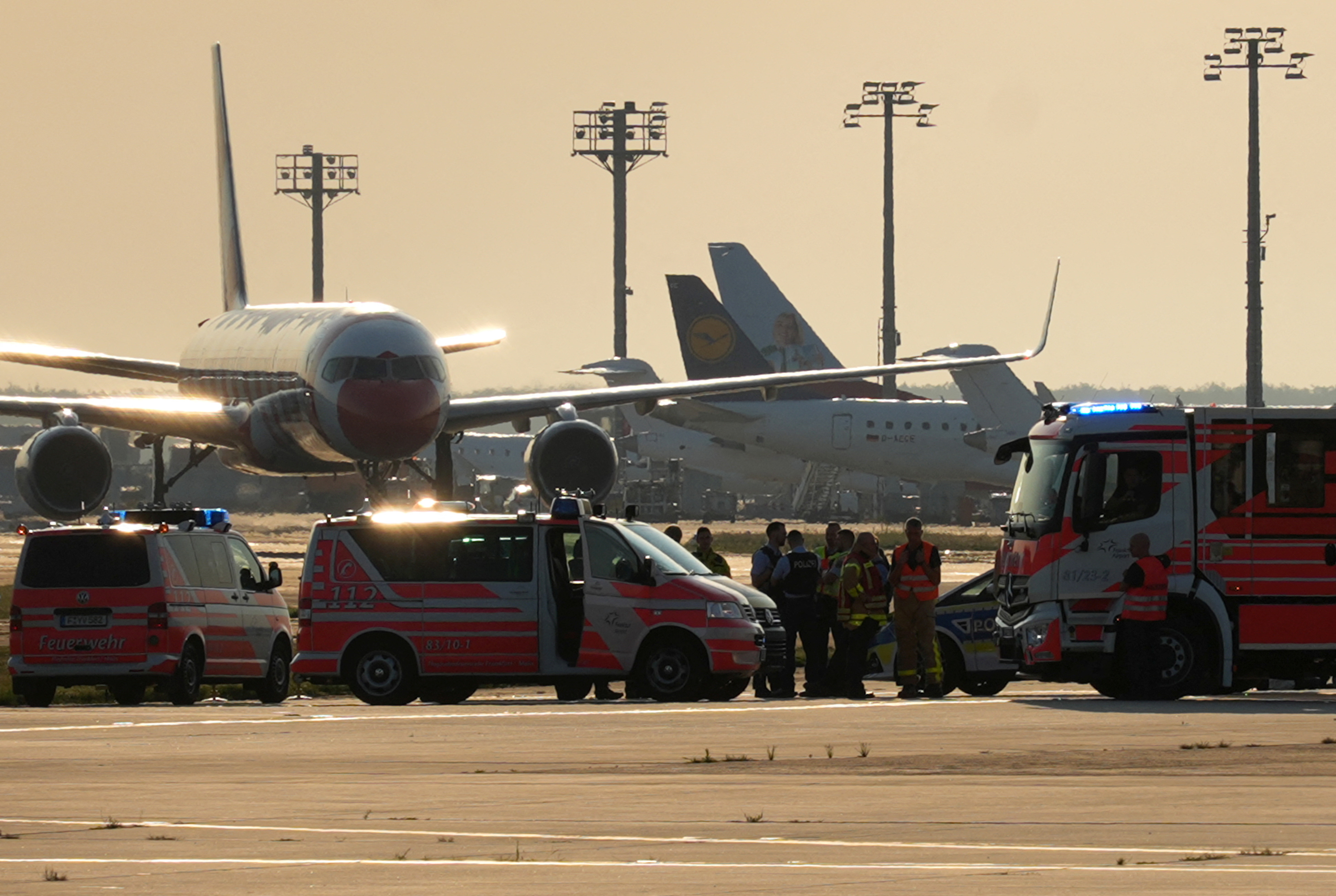 Police, security and medical staff parked their vehicles after activists of the "Letzte Generation" (Last Generation) staged a demonstration near the runways at the airport in Frankfurt,