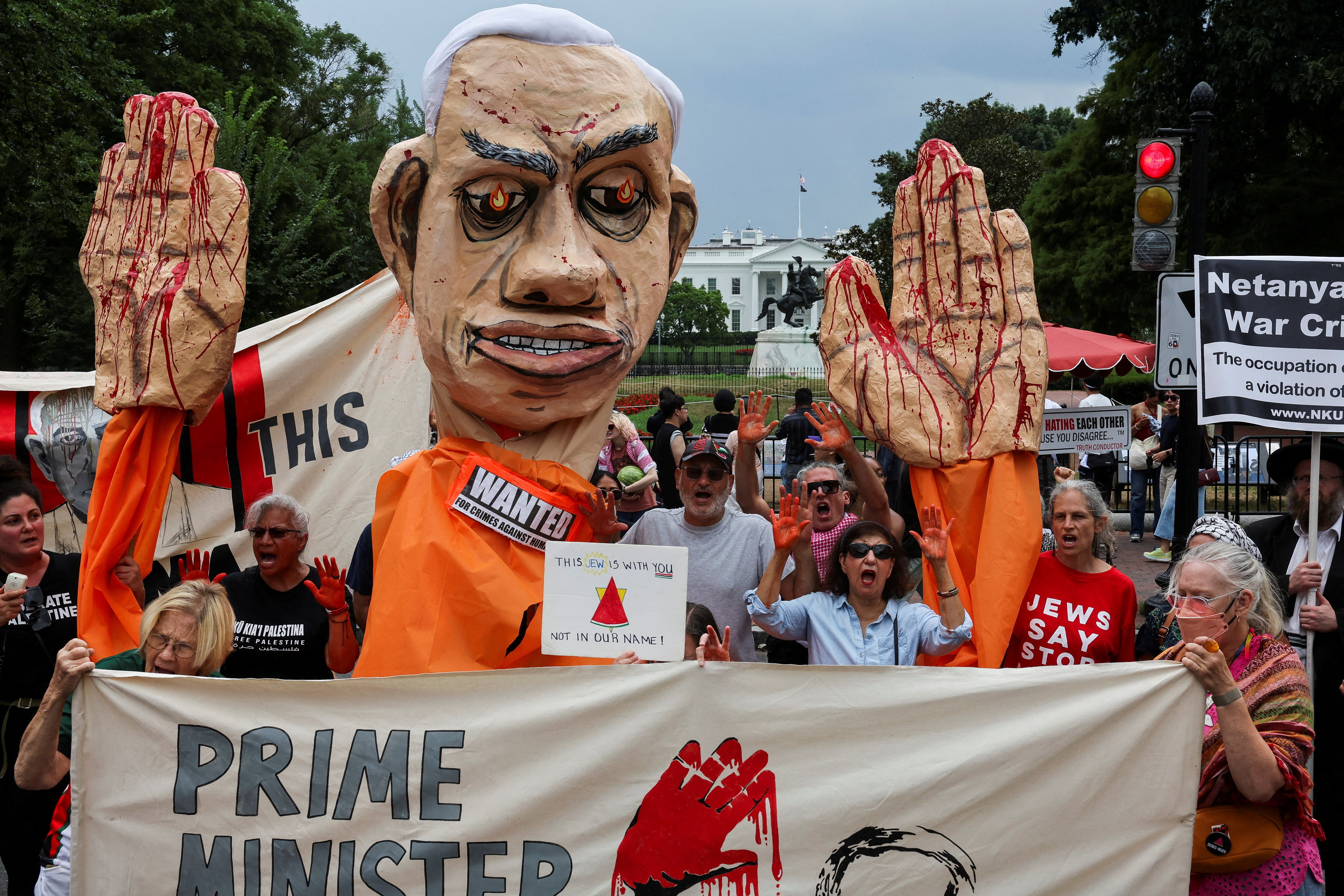 Demonstrators gather during a pro-Palestinian rally on the day Israeli Prime Minister Benjamin Netanyahu is scheduled to hold White House meetings with U.S. President Joe Biden and Vice President Kamala Harris, at Lafayette Square Park in Washington, D.C., U.S., July 25, 2024. REUTERS/ Umit Bektas