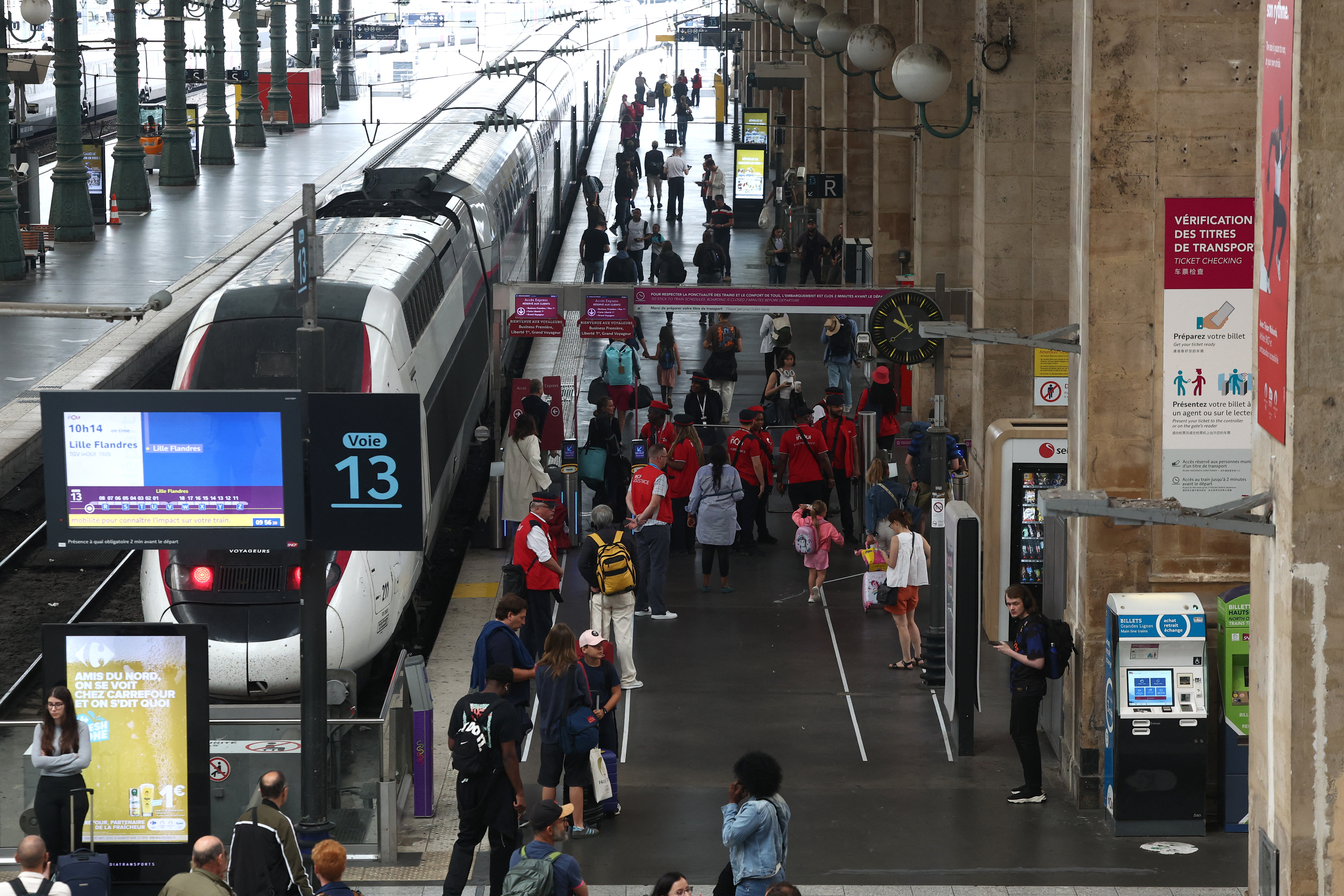 Passengers are pictured at Gare du Nord station after threats against France's high-speed TGV network