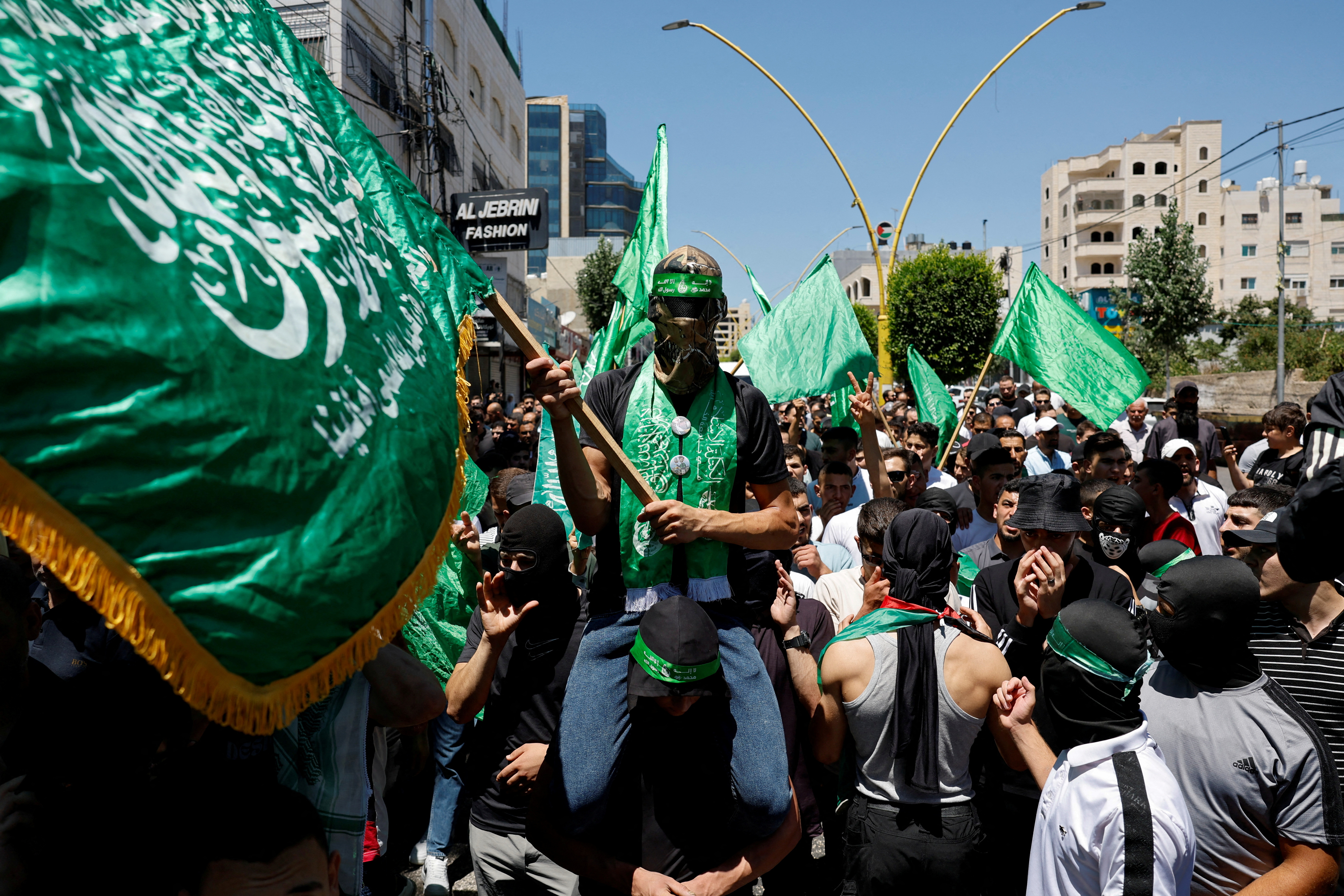 Palestinians attend a protest after the assassination of Hamas leader Ismail Haniyeh in Iran, in Hebron