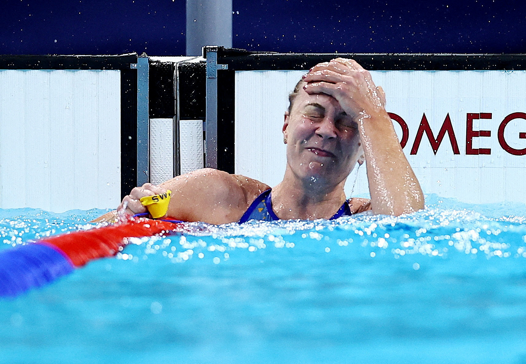 Paris 2024 Olympics - Swimming - Men's 100m Freestyle Final - Paris La Defense Arena, Nanterre, France - July 31, 2024. Sarah Sjostrom of Sweden reacts after winning the race.