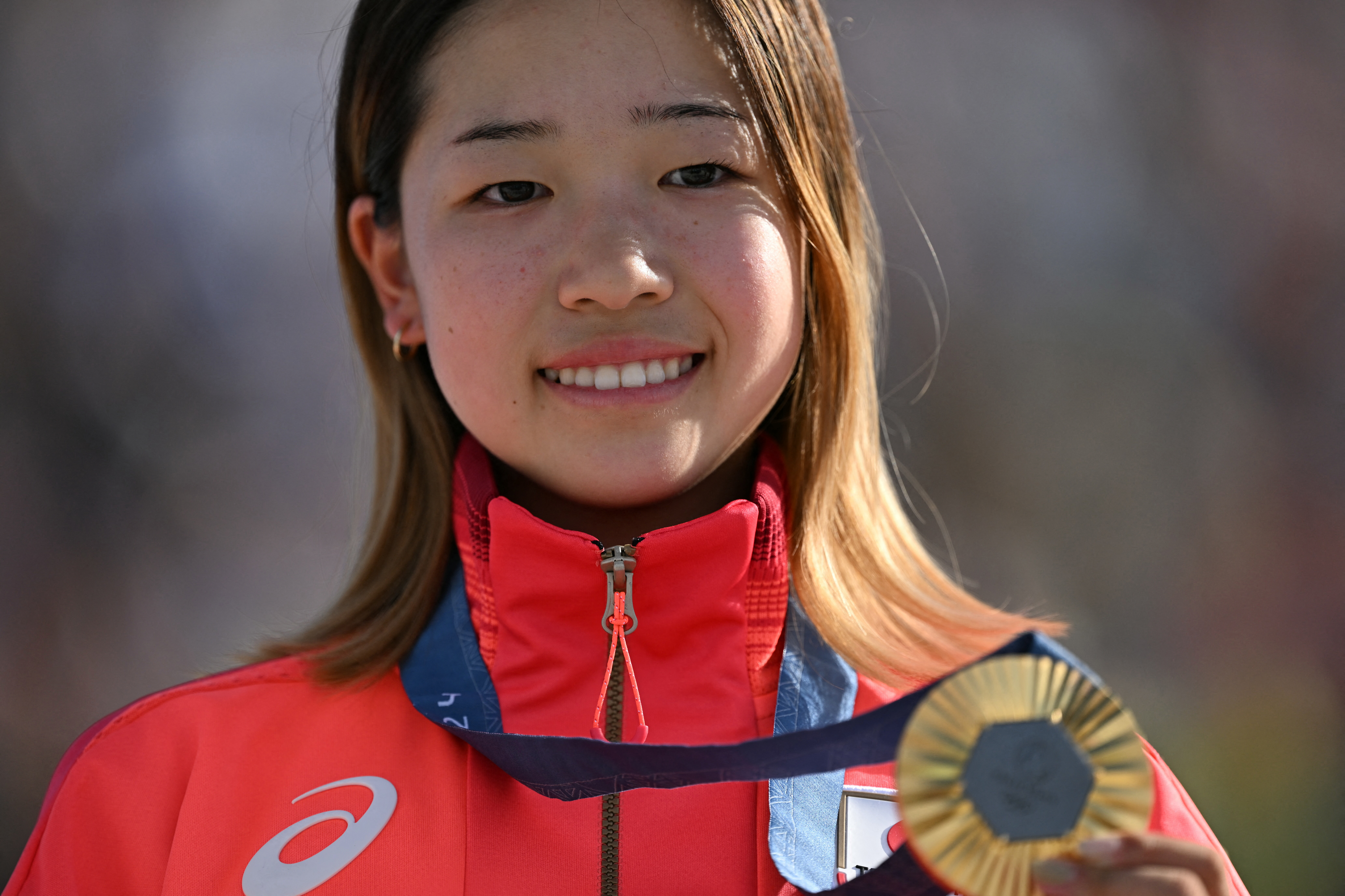 Coco Yoshizawa with gold Olympic medal.