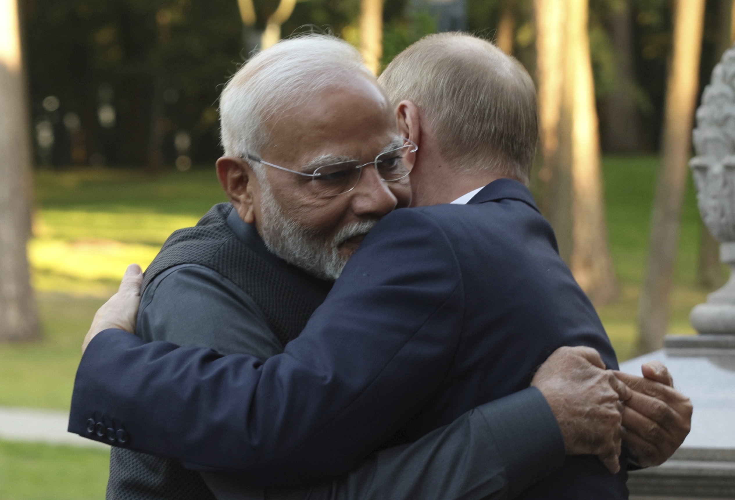 Indian Prime Minister Narendra Modi, left, and Russian President Vladimir Putin embrace during an informal meeting at Novo-Ogaryovo residence, outside Moscow, Russia, Monday, July 8, 2024. (Gavriil Grigorov, Sputnik, Kremlin Pool Photo via AP)