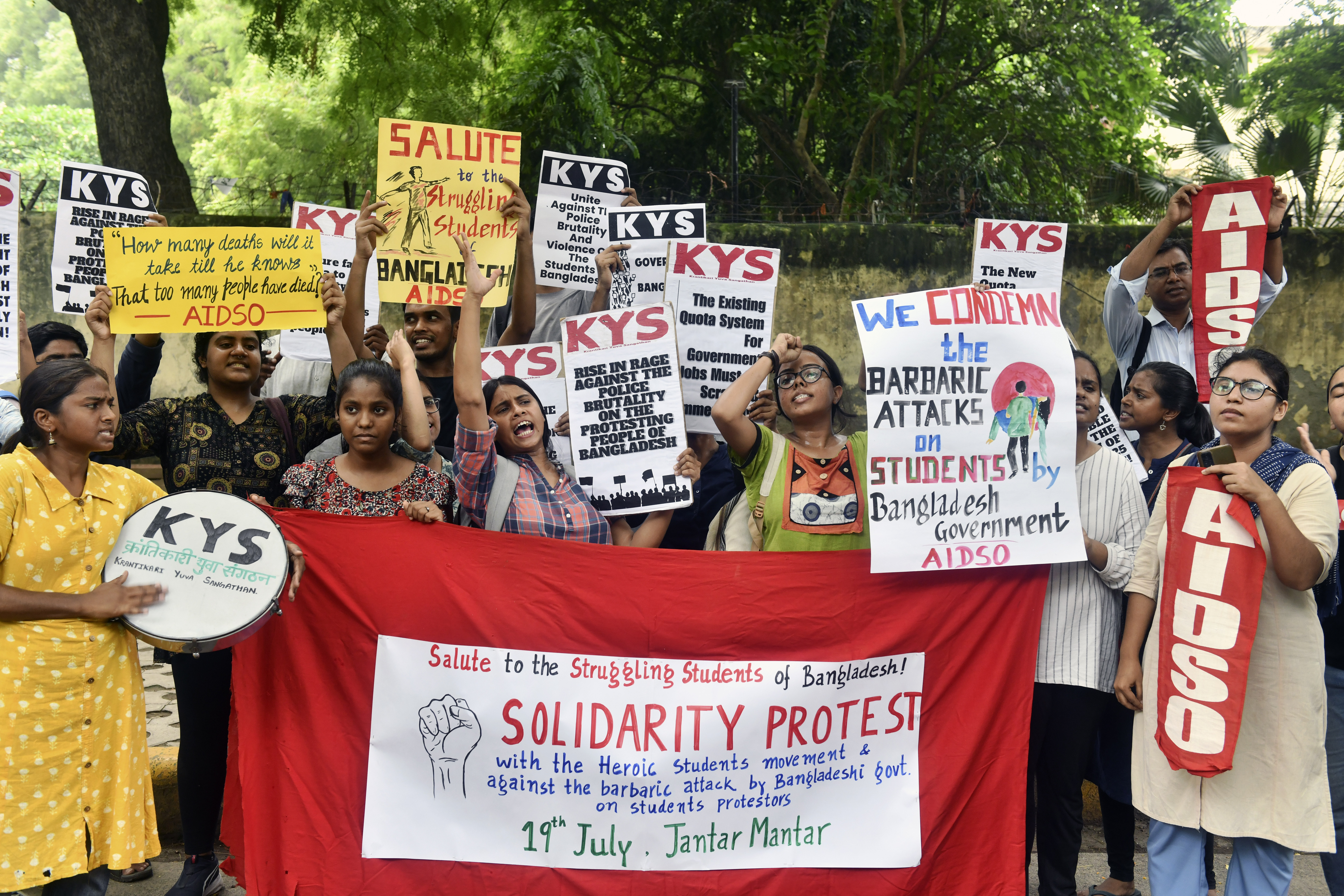Activists of All India Democratic Students' Organisation (AIDSO) shout slogans in solidarity with protesting students in Bangladesh, at a protest gathering in New Delhi, India, 