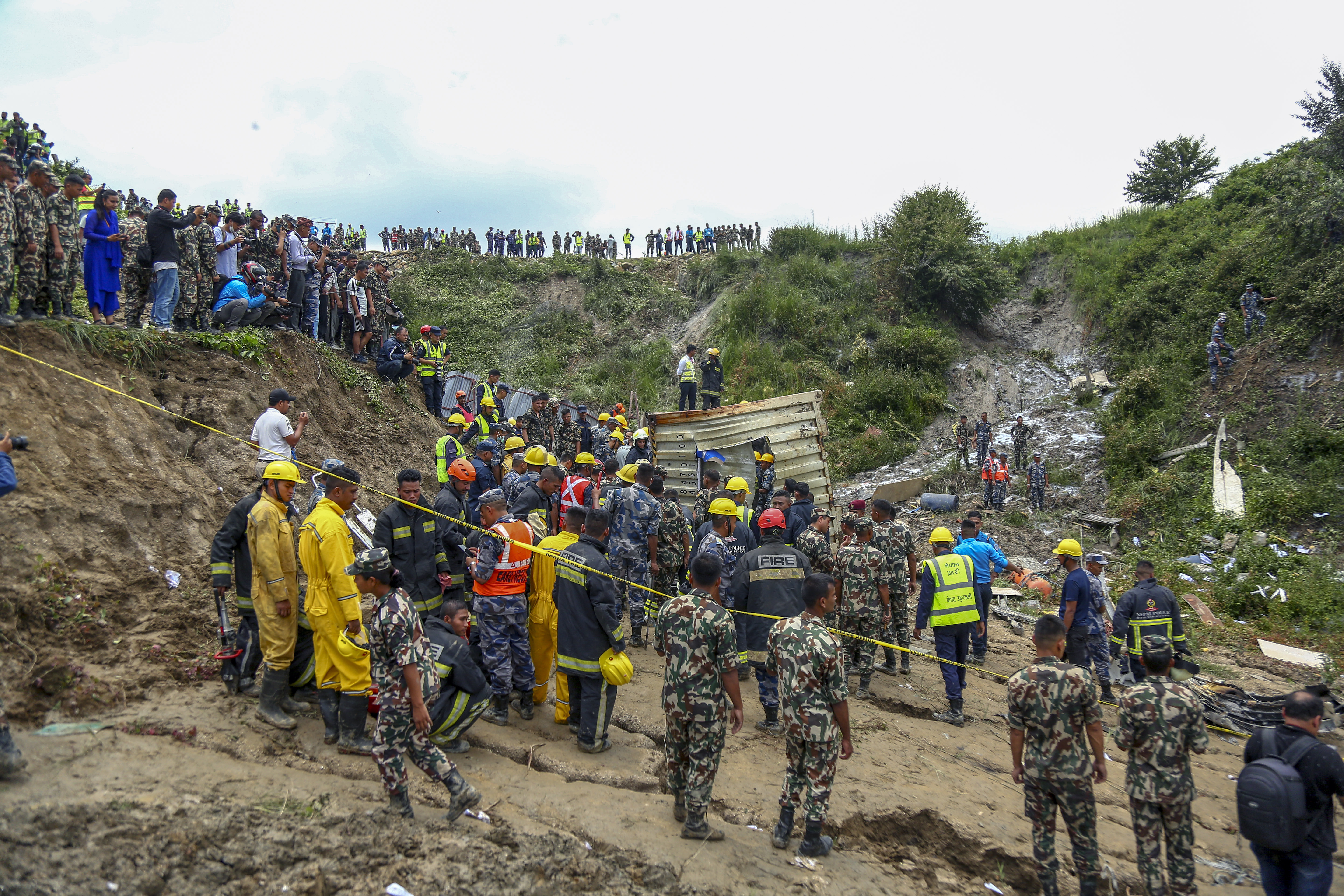 Nepal army personnel cordon off a plane crash site at Tribhuvan International Airport in Kathmandu