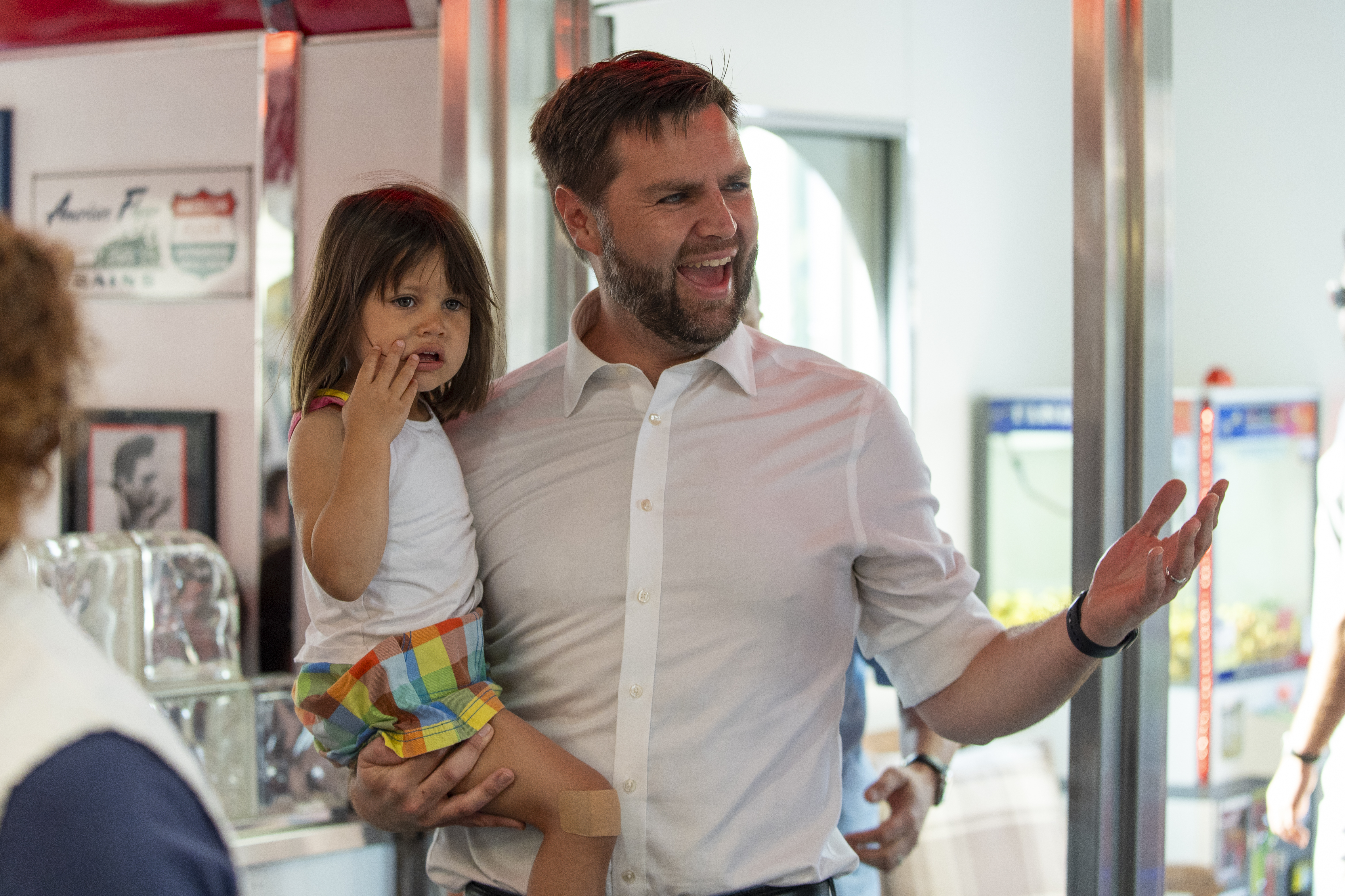 Republican vice presidential candidate Sen. JD Vance, R-Ohio, arrives at the Park Diner carrying his daughter Mirabel, 2, Sunday, July 28, 2024,