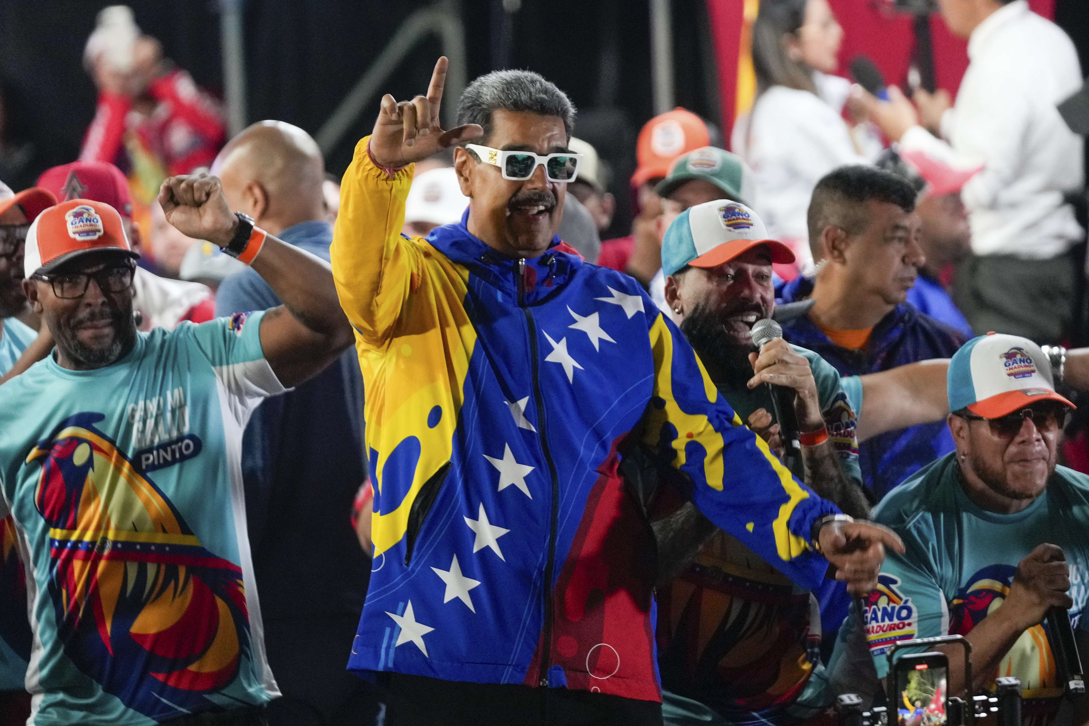 President Nicolas Maduro dances outside the Miraflores presidential palace after electoral authorities declared him the winner