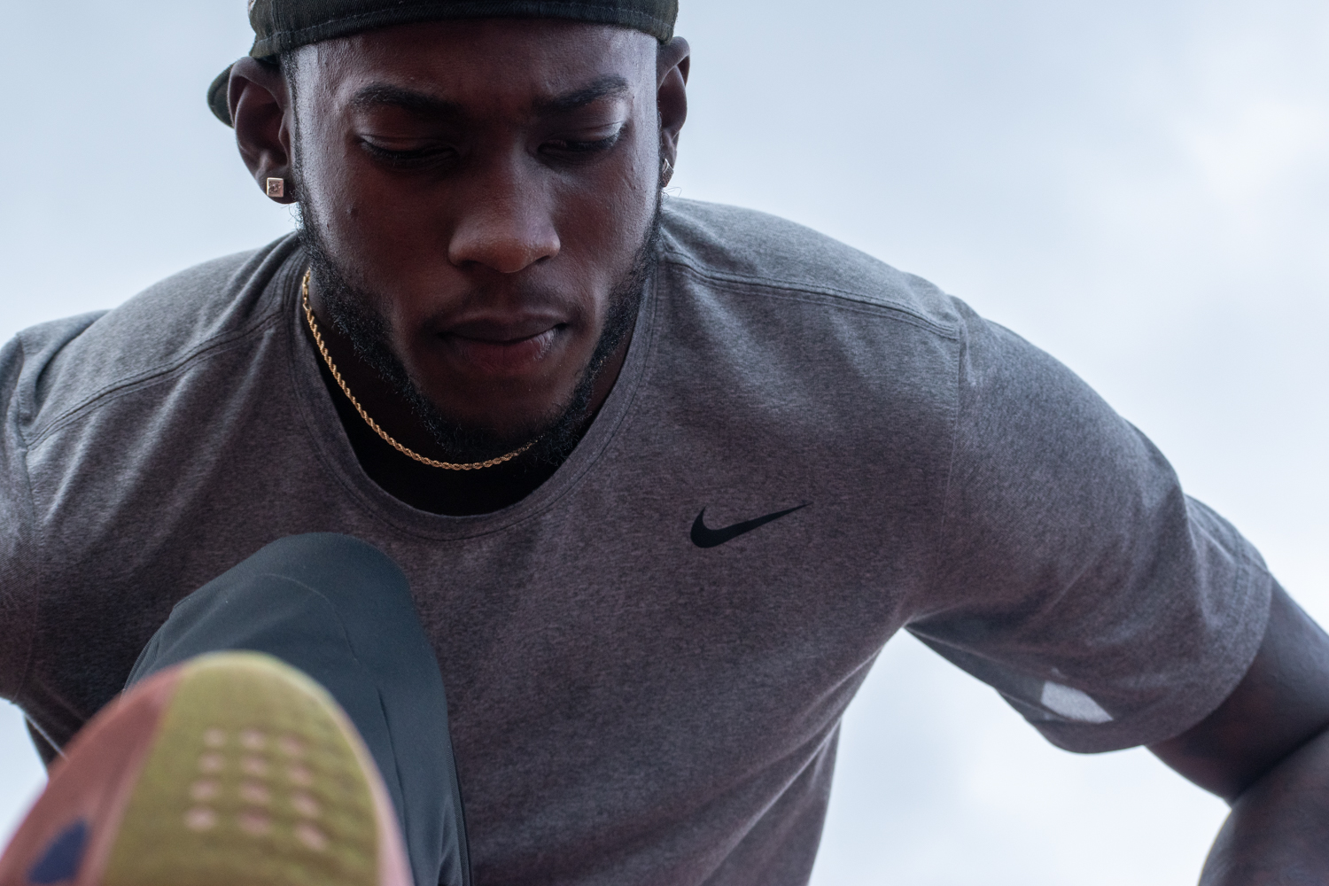 A close-up of Tamarri Lindo as he stretches.