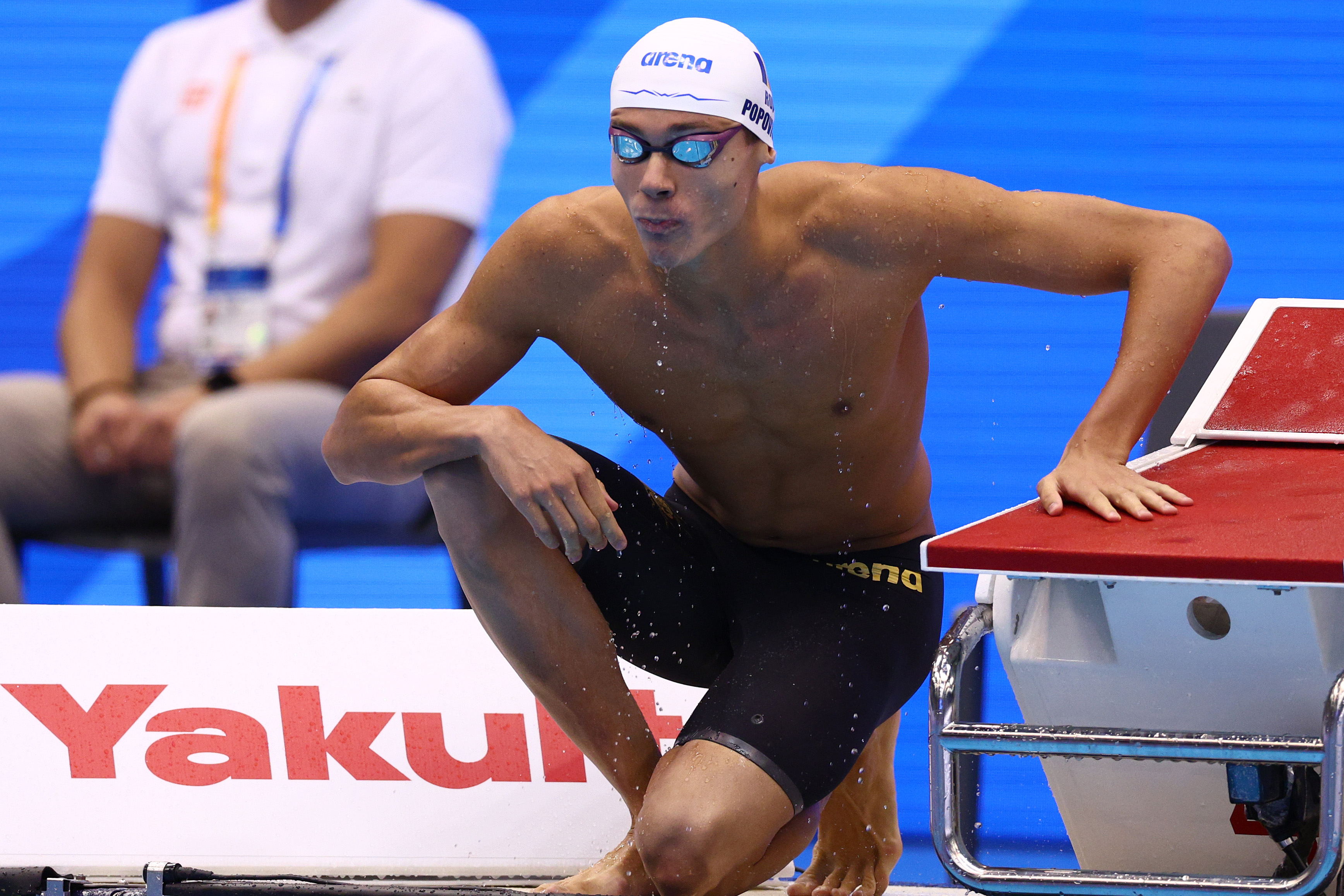 Swimmer on knee before race.