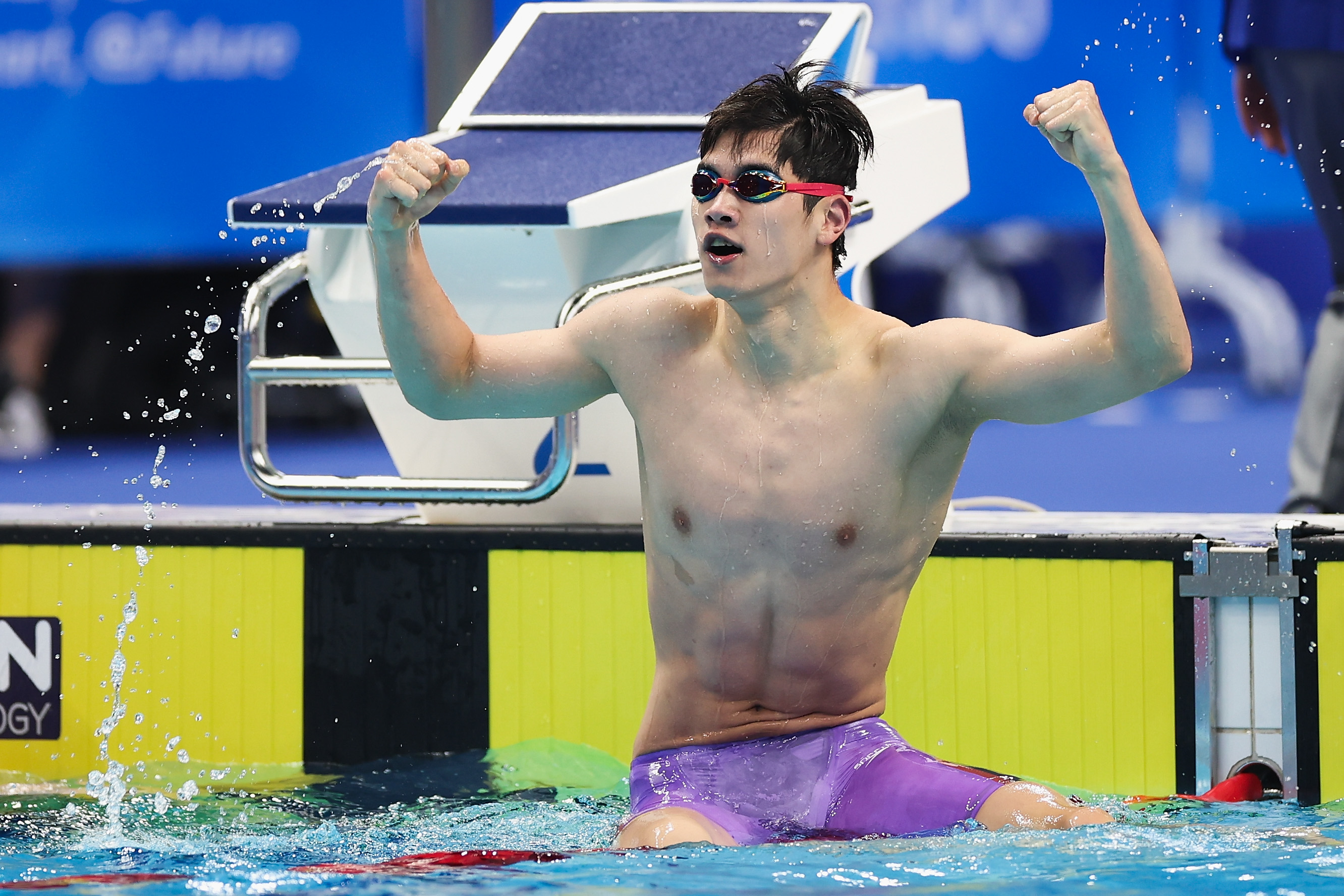 Swimmer celebrates victory.