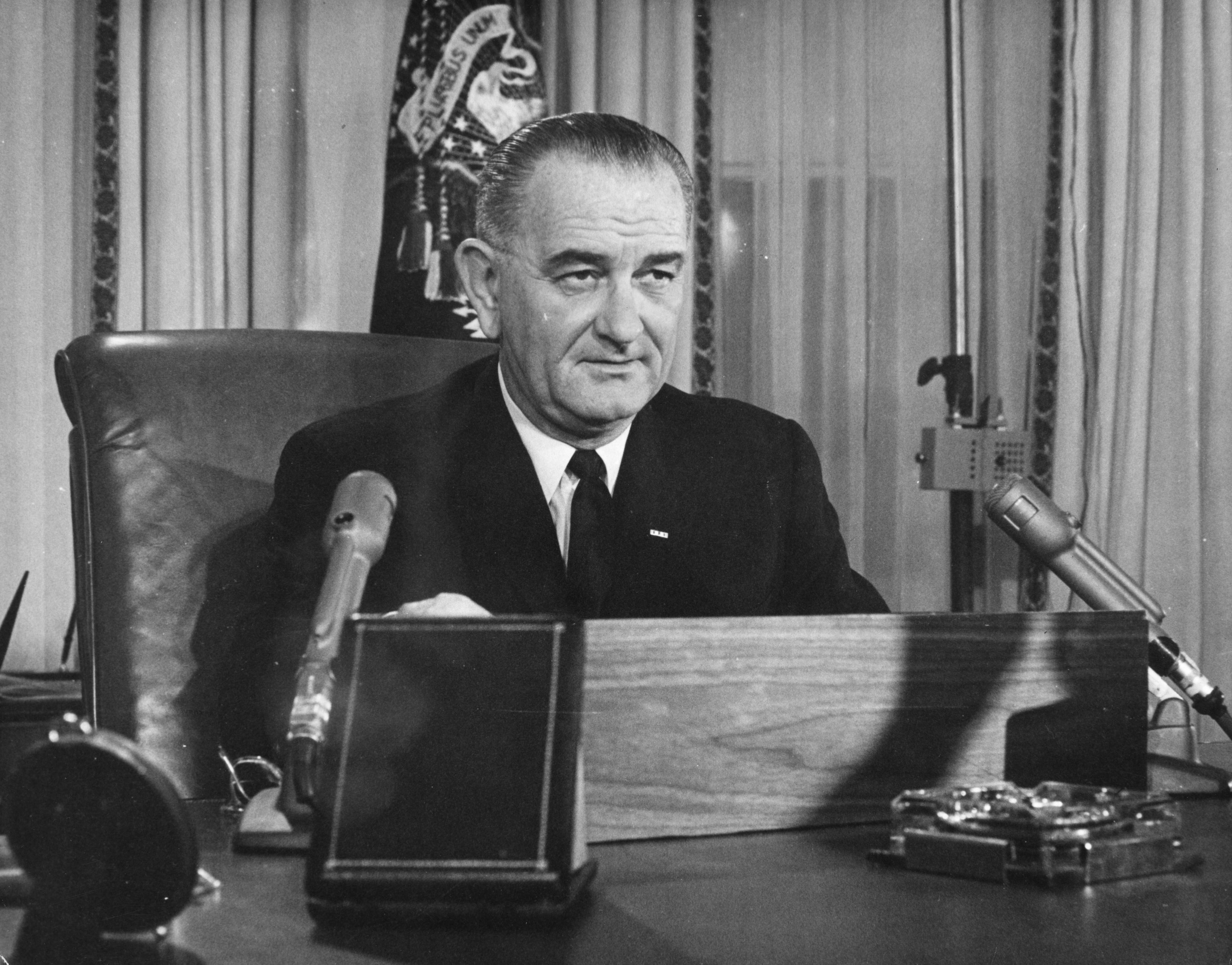2nd December 1963: American President Lyndon Baines Johnson addresses the nation on his first thanksgiving day television programme, broadcast from the executive offices of the White House.