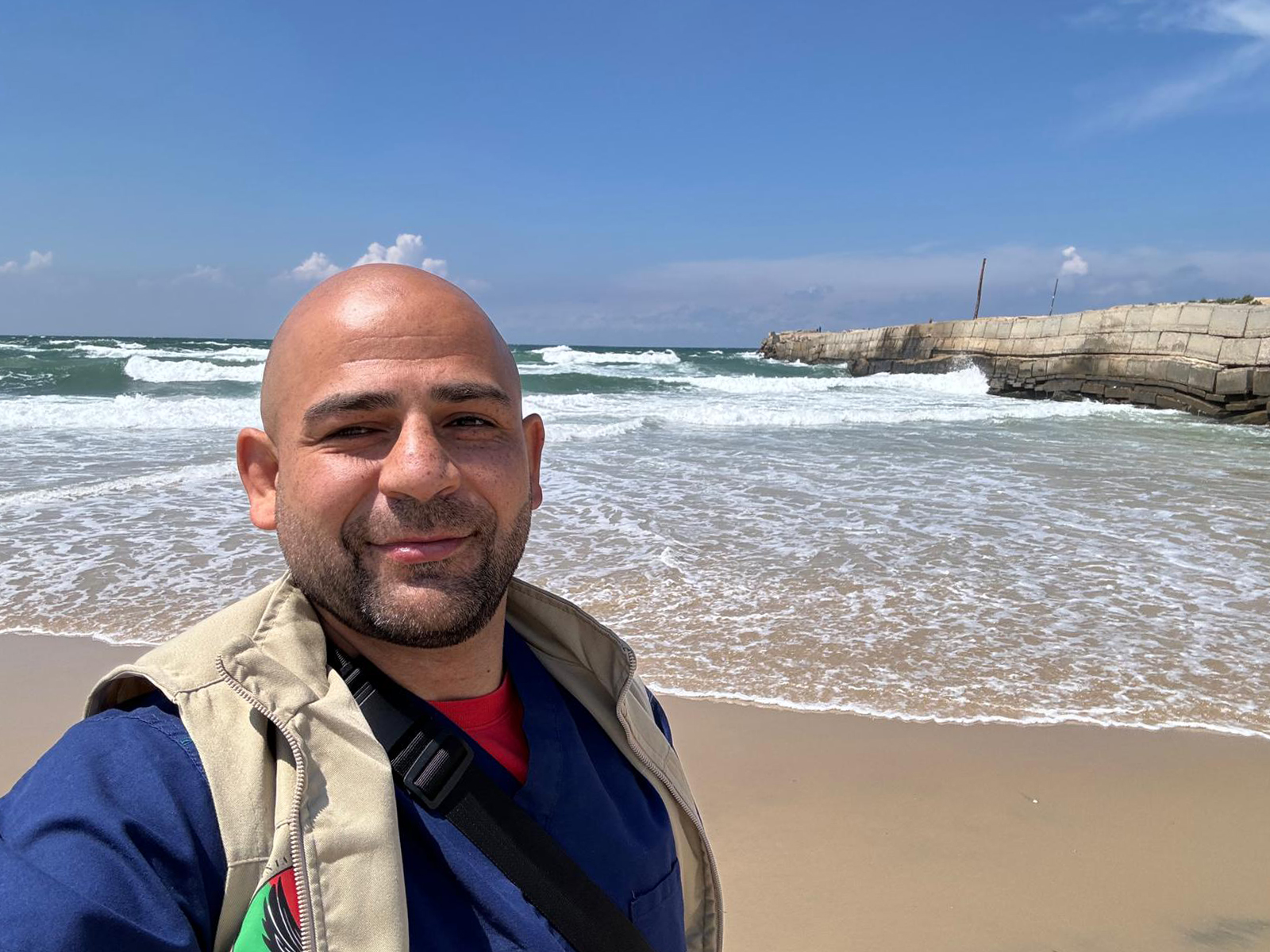 Omar Sabha takes a selfie on the sandy shores of the Mediterranean Sea