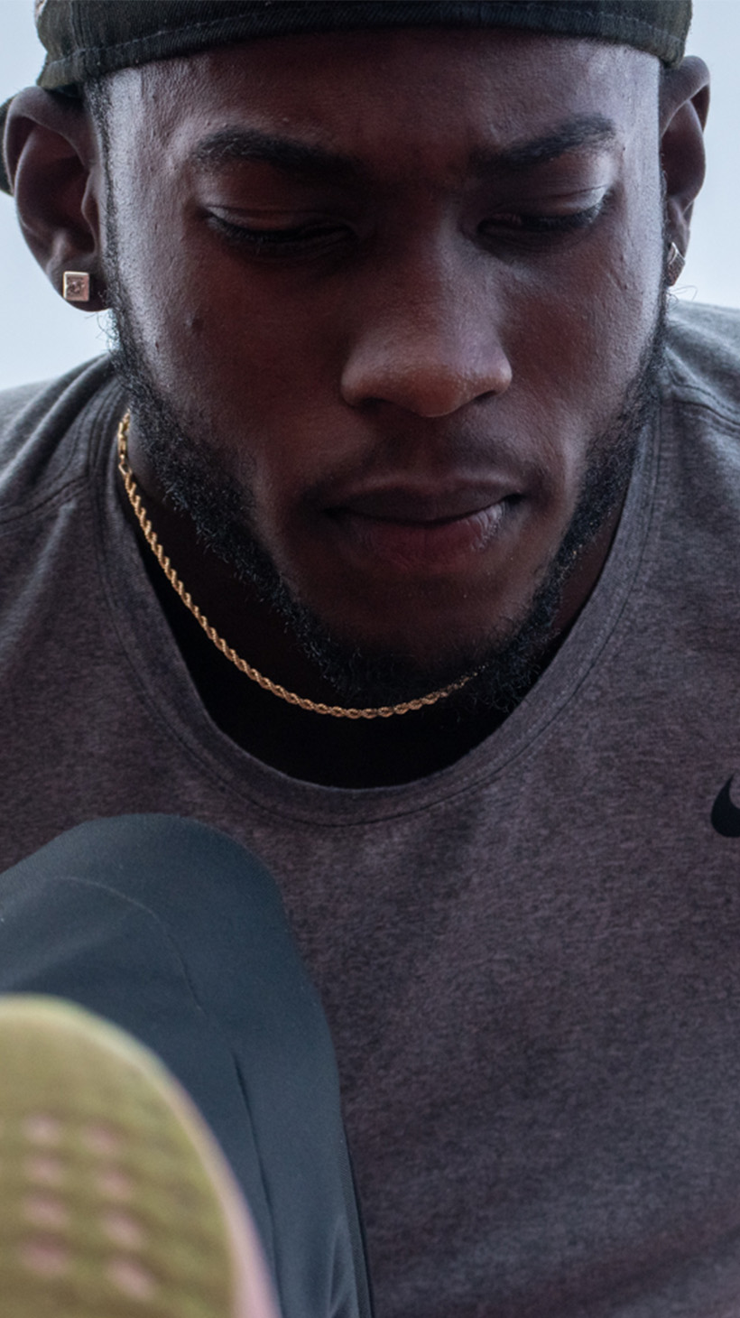 A close-up of Tamarri Lindo as he stretches.