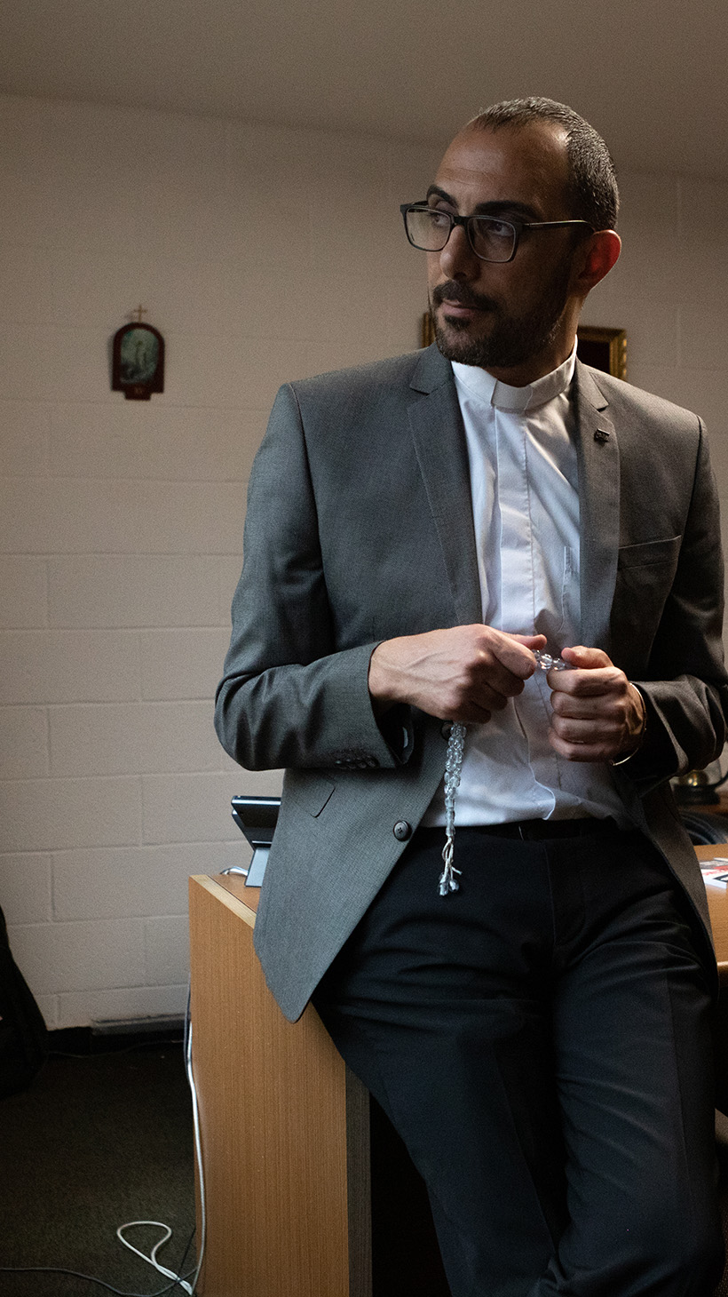 New York City, NY. Friday, June 14 2024. Pastor Khalilia poses for a portrait in his office at Redeemer-St. John's. He often reaches for the set of prayer beads in his hands, a gift from a shopkeeper in Bethlehem.