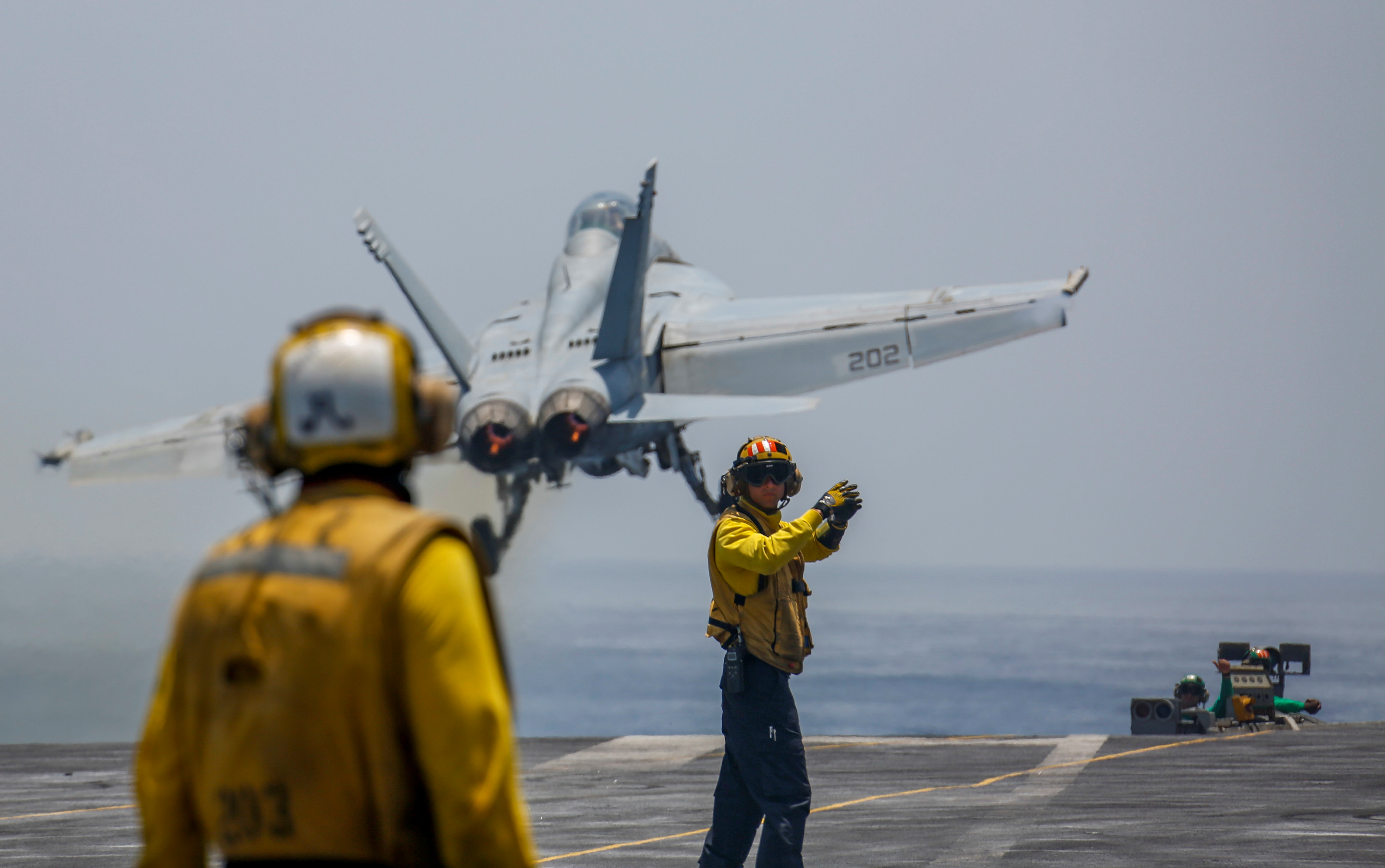 An F-18 Super Hornet taking off from the deck of the Abraham Lincoln.