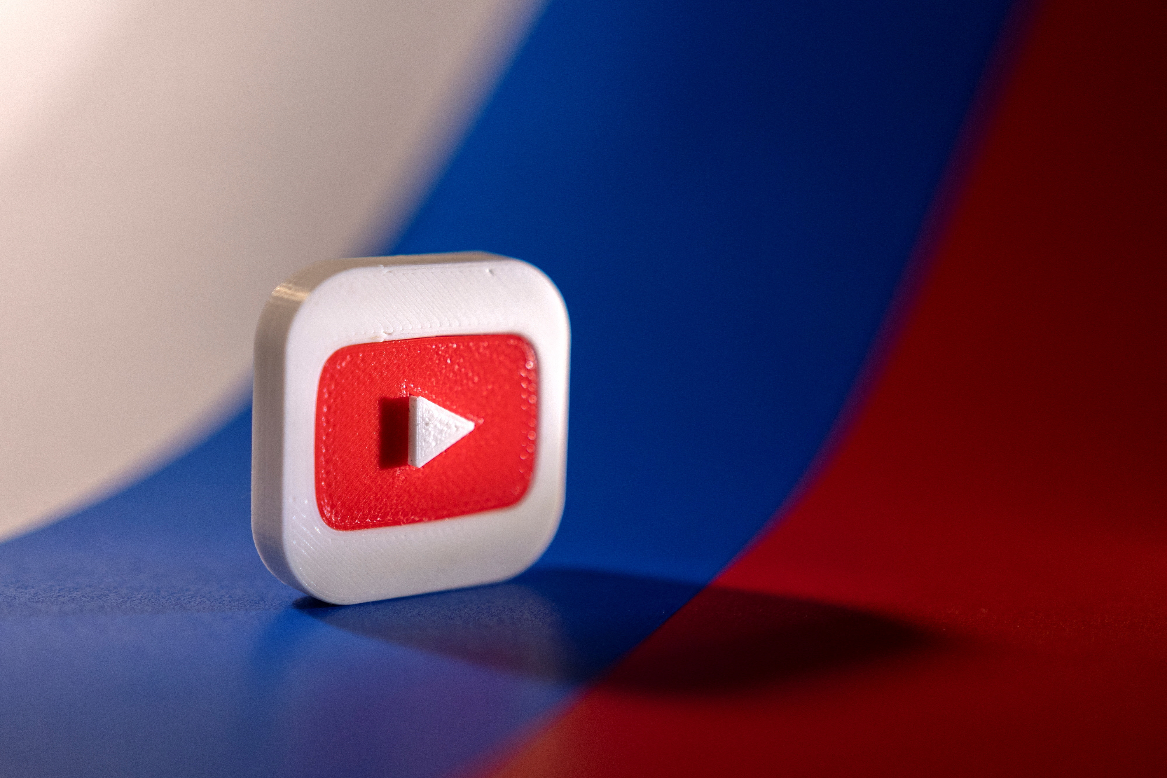 Youtube logo is placed on a Russian flag