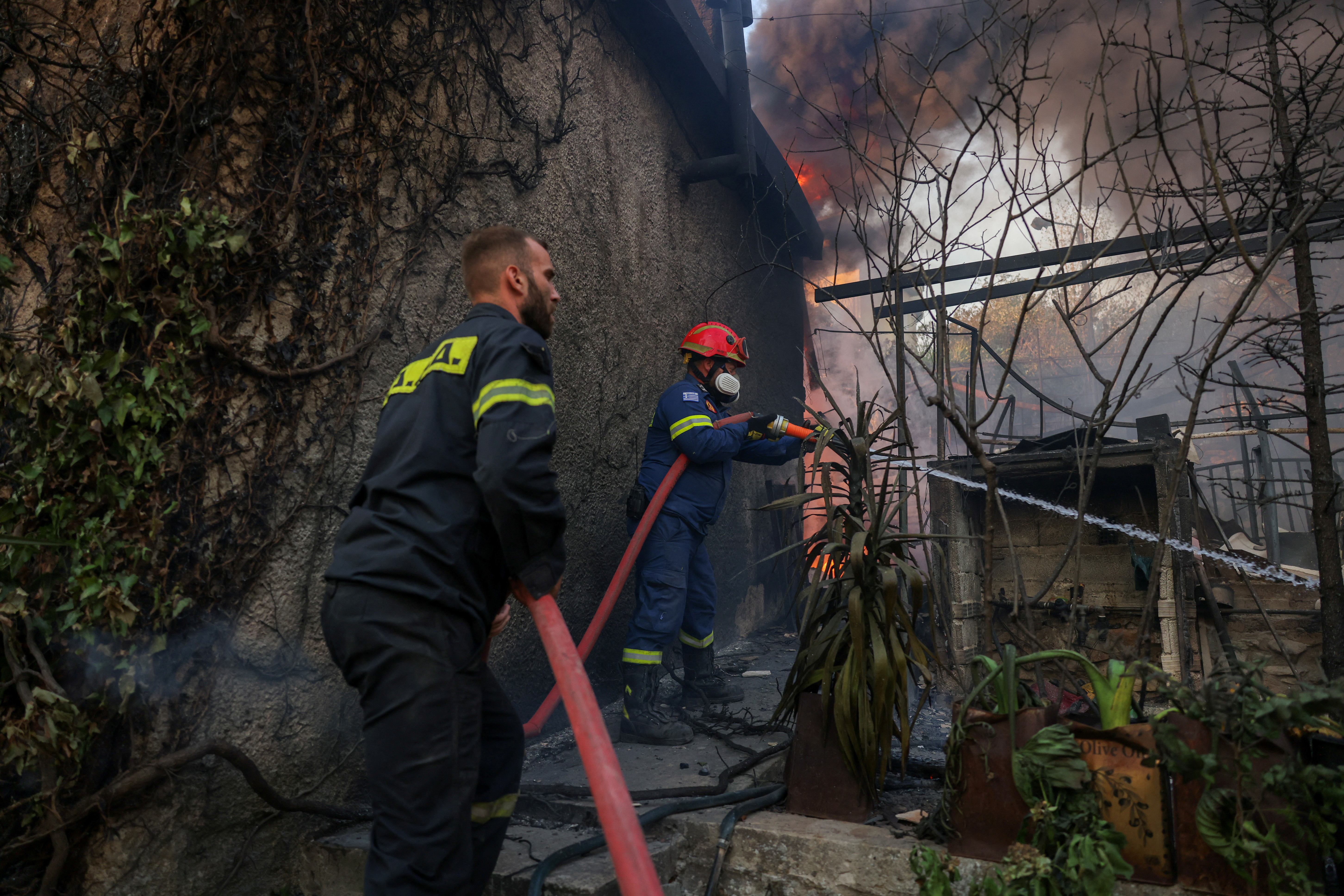 Major wildfire rages out of control on fringes of Greek capital; hundreds of firefighters deployed