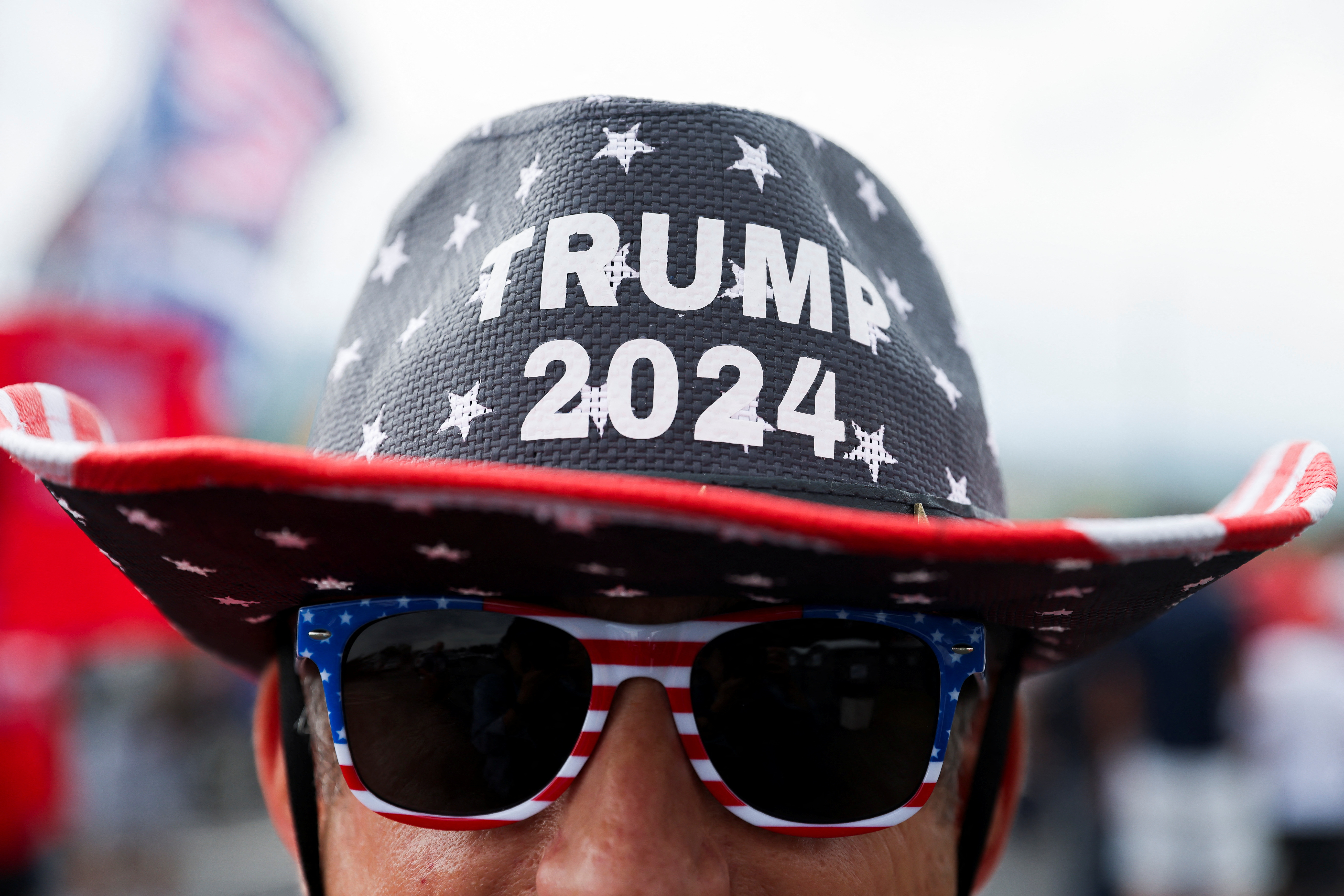 A person wears a hat in support of Trump's 2024 presidential campaign