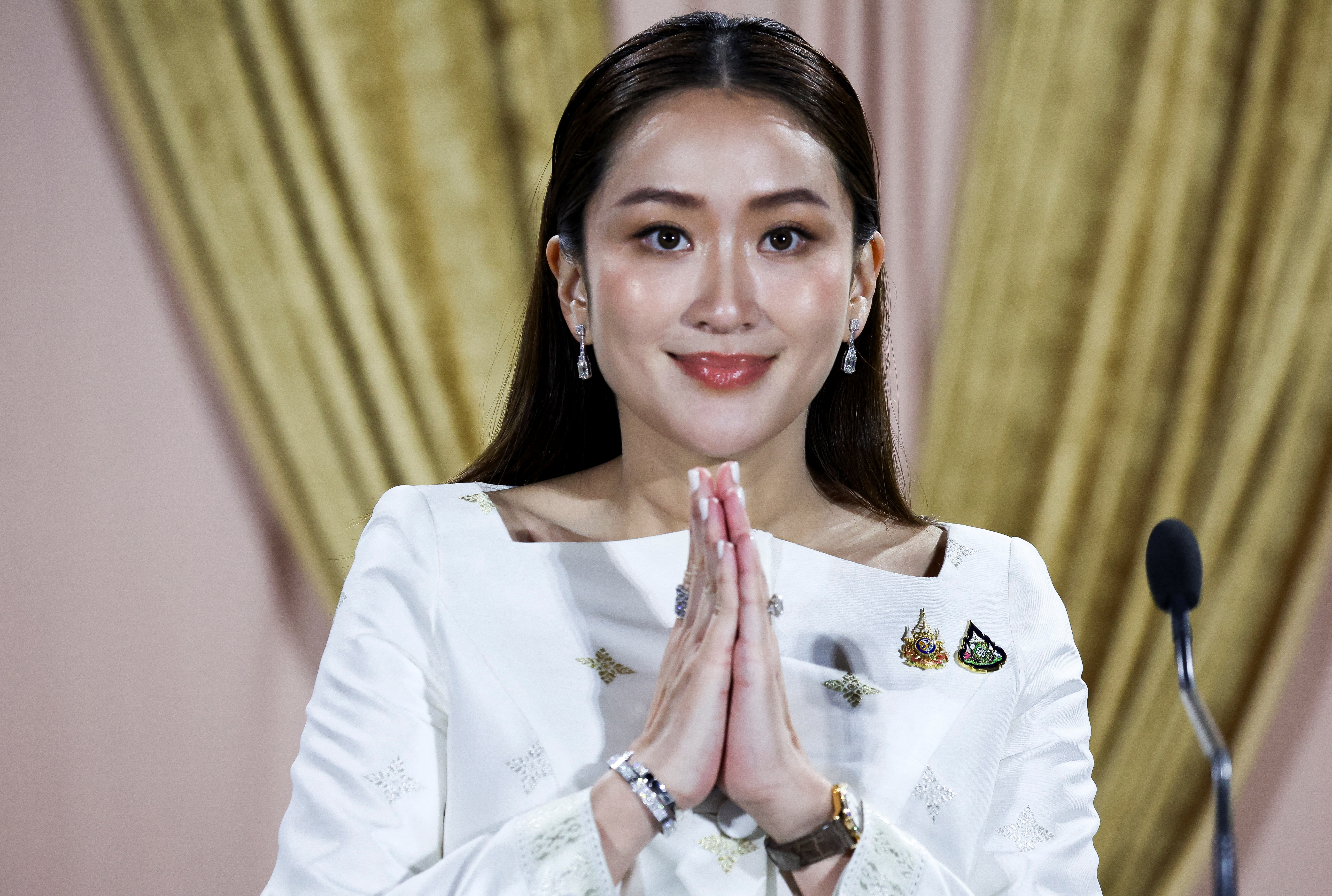 Thailand's Prime Minister Paetongtarn Shinawatra attends a press conference at the Pheu Thai party headquarters following a royal endorsement ceremony in Bangkok, Thailand