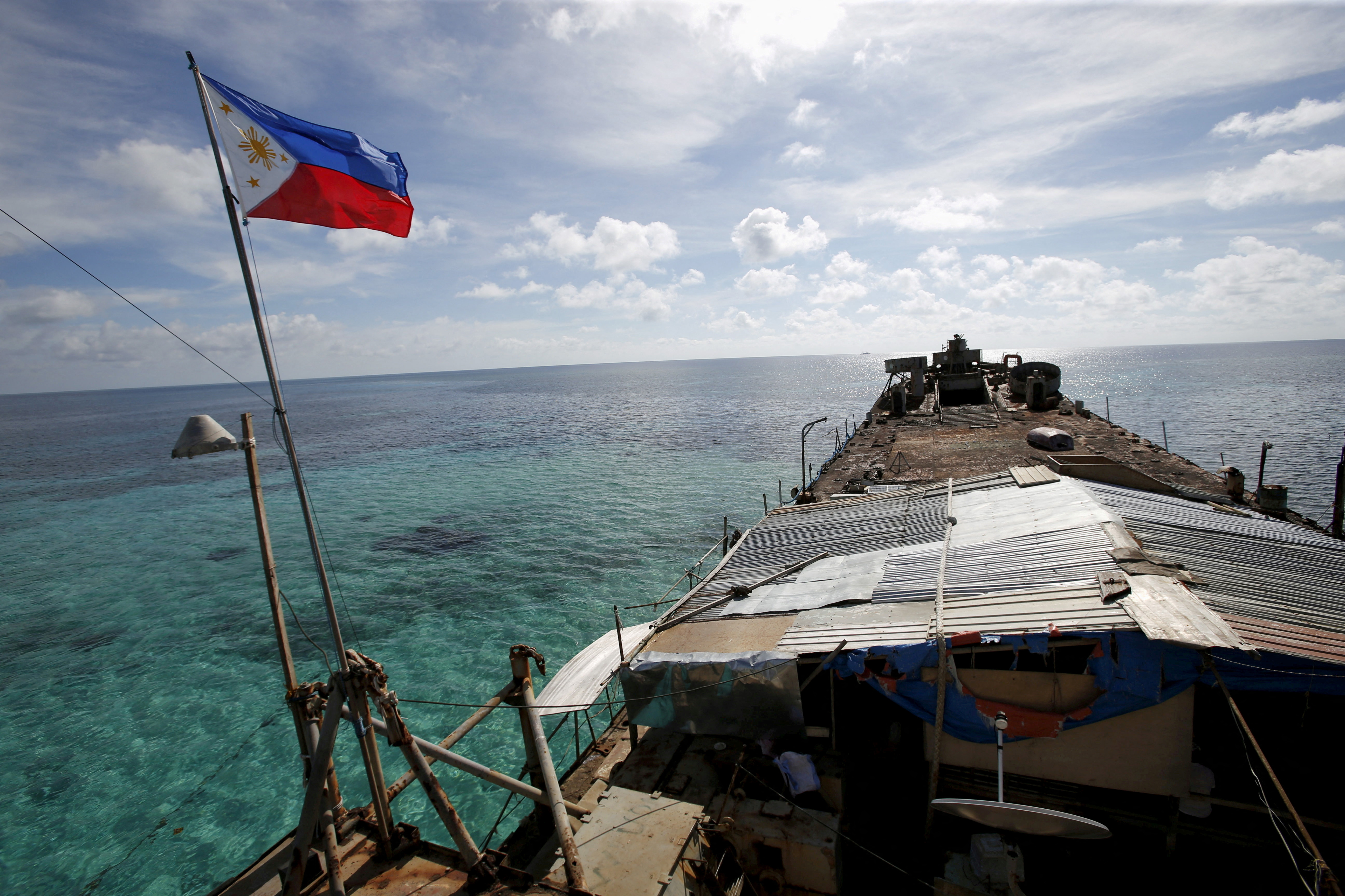 A Philippine flag on a dilapidated Philippine Navy ship