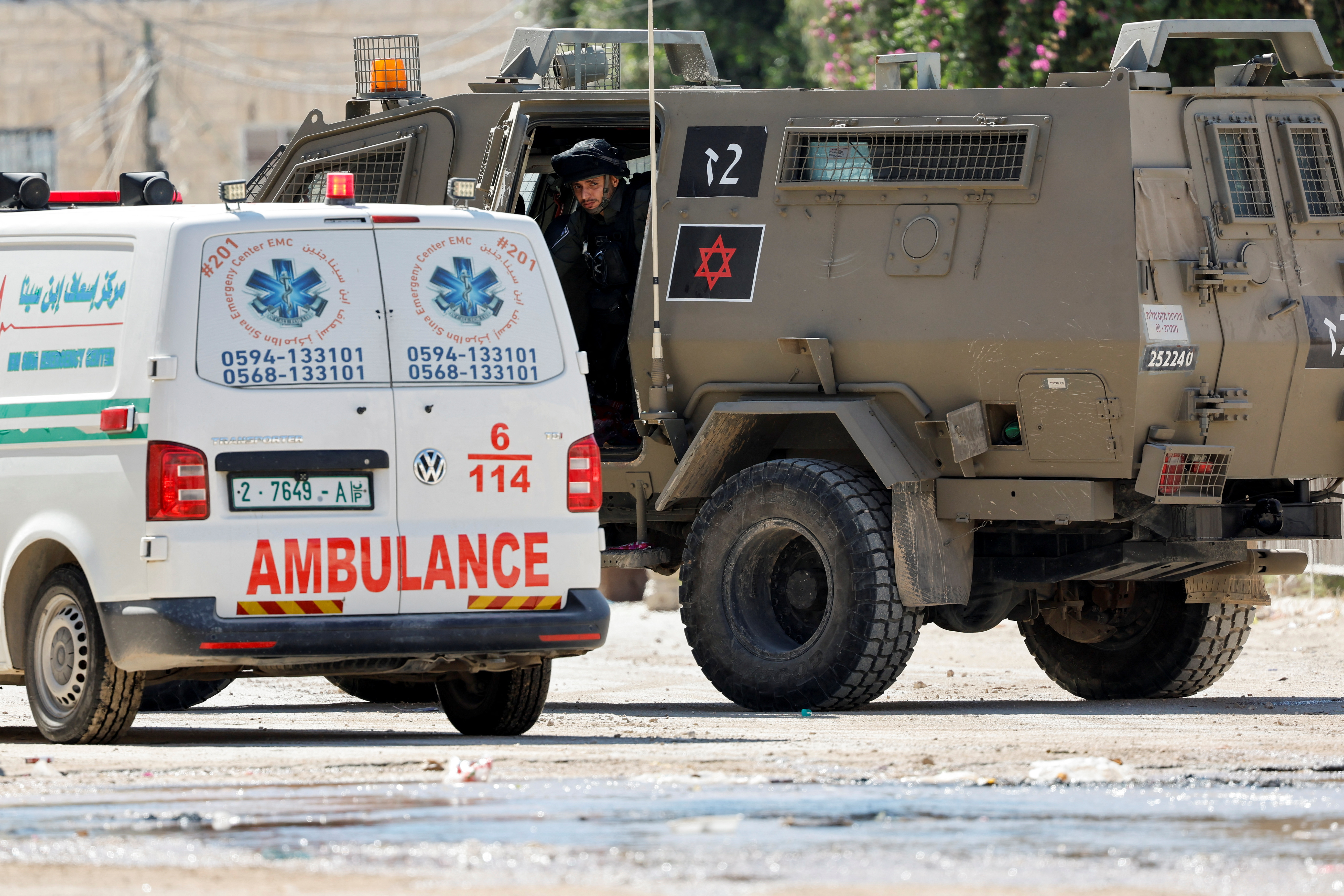 A member of the Israeli security forces looks out from a military vehicle, during a raid, in Jenin, in the Israeli-occupied West Bank, August 28, 2024. [Raneen Sawafta/Reuters]