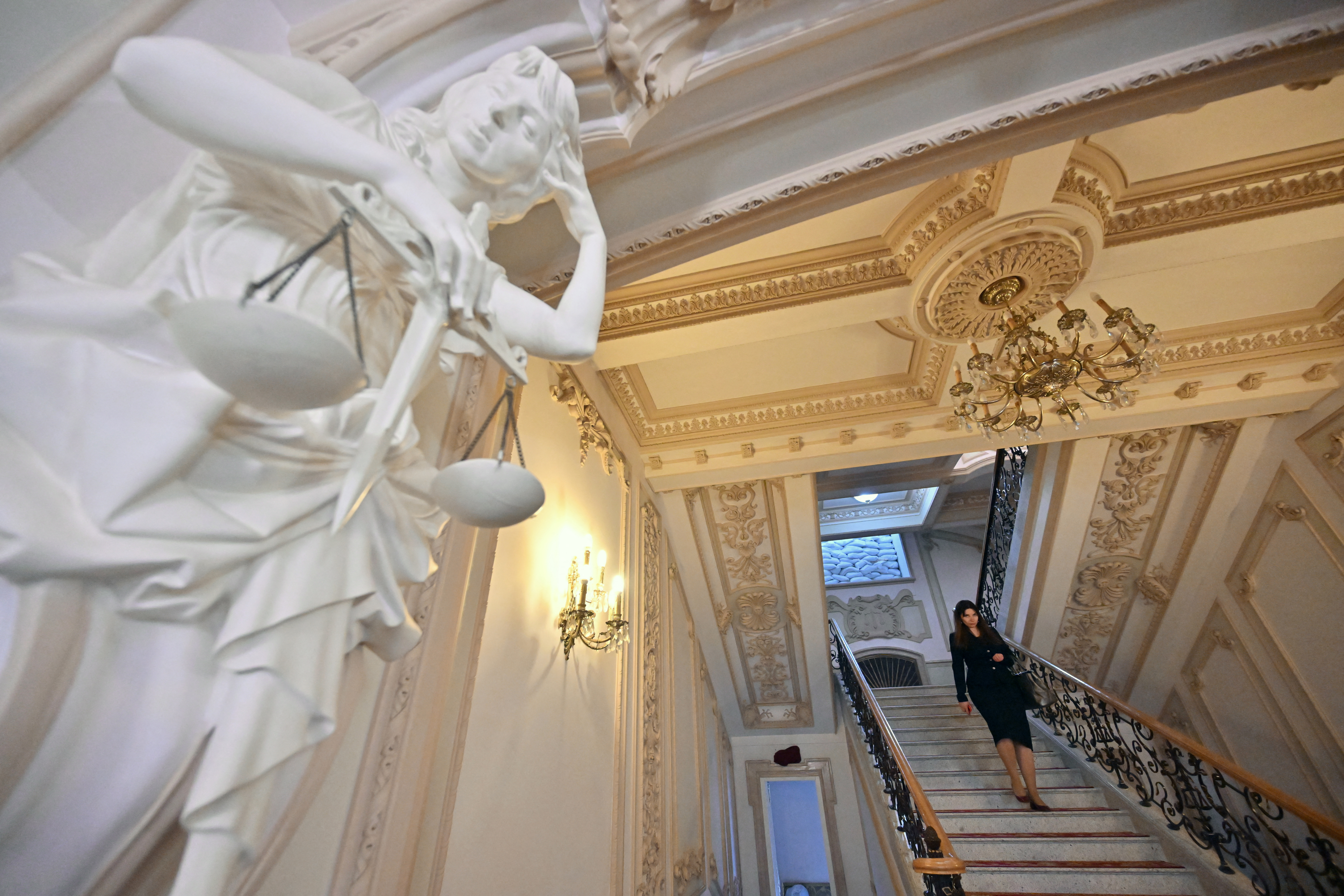 A Supreme Court judge of Ukraine leaves after a voting session to remove the head of the court Vsevolod Kniaziev in Kyiv, on May 16, 2023. Following a 2.7 million dollars bribery inquiry and Kniaziev's detention, 140 out of 142 judges backed a decision to remove him from office at a plenum of the Supreme Court. (Photo by Sergei SUPINSKY / AFP)