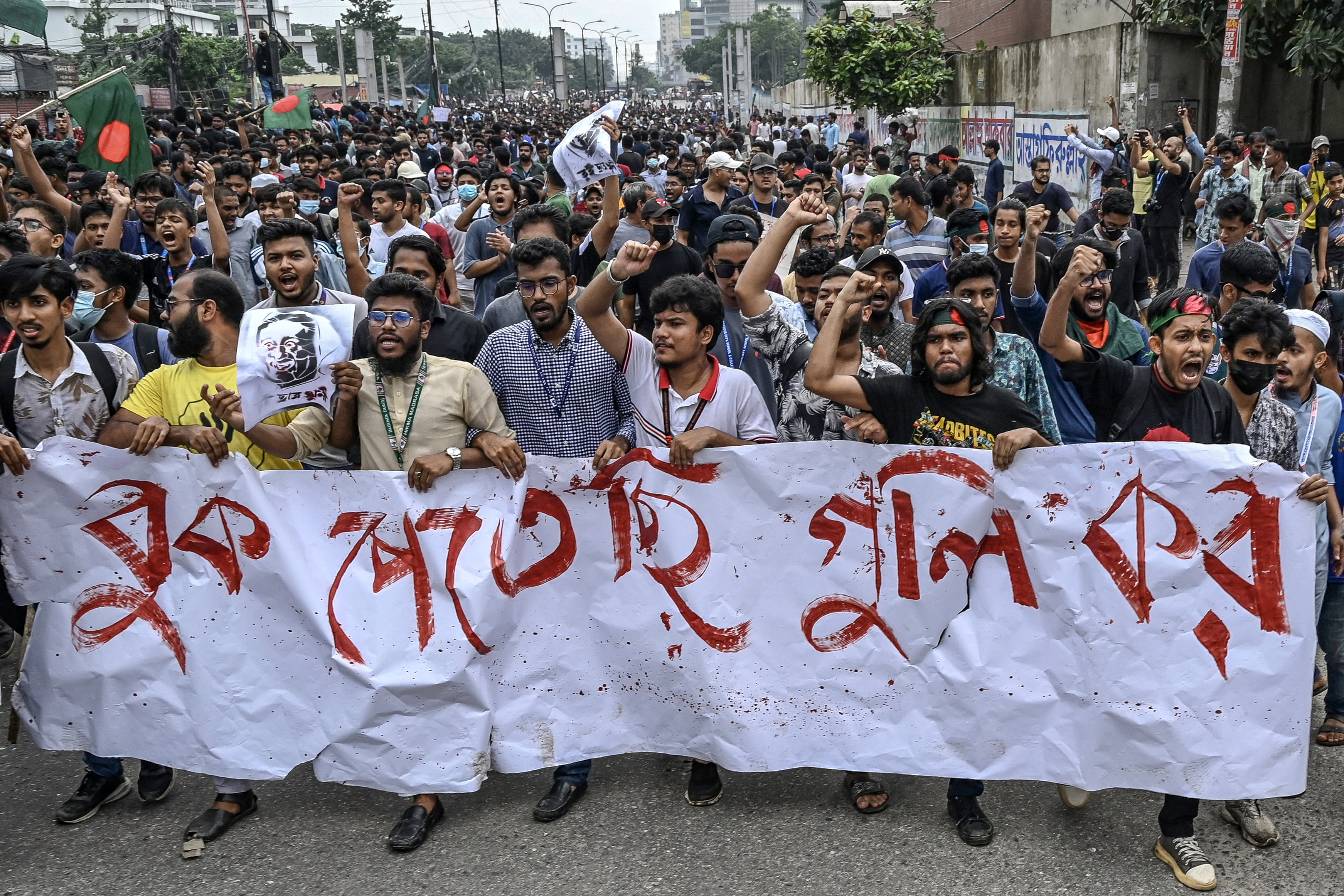 Students shout slogans during a protest march