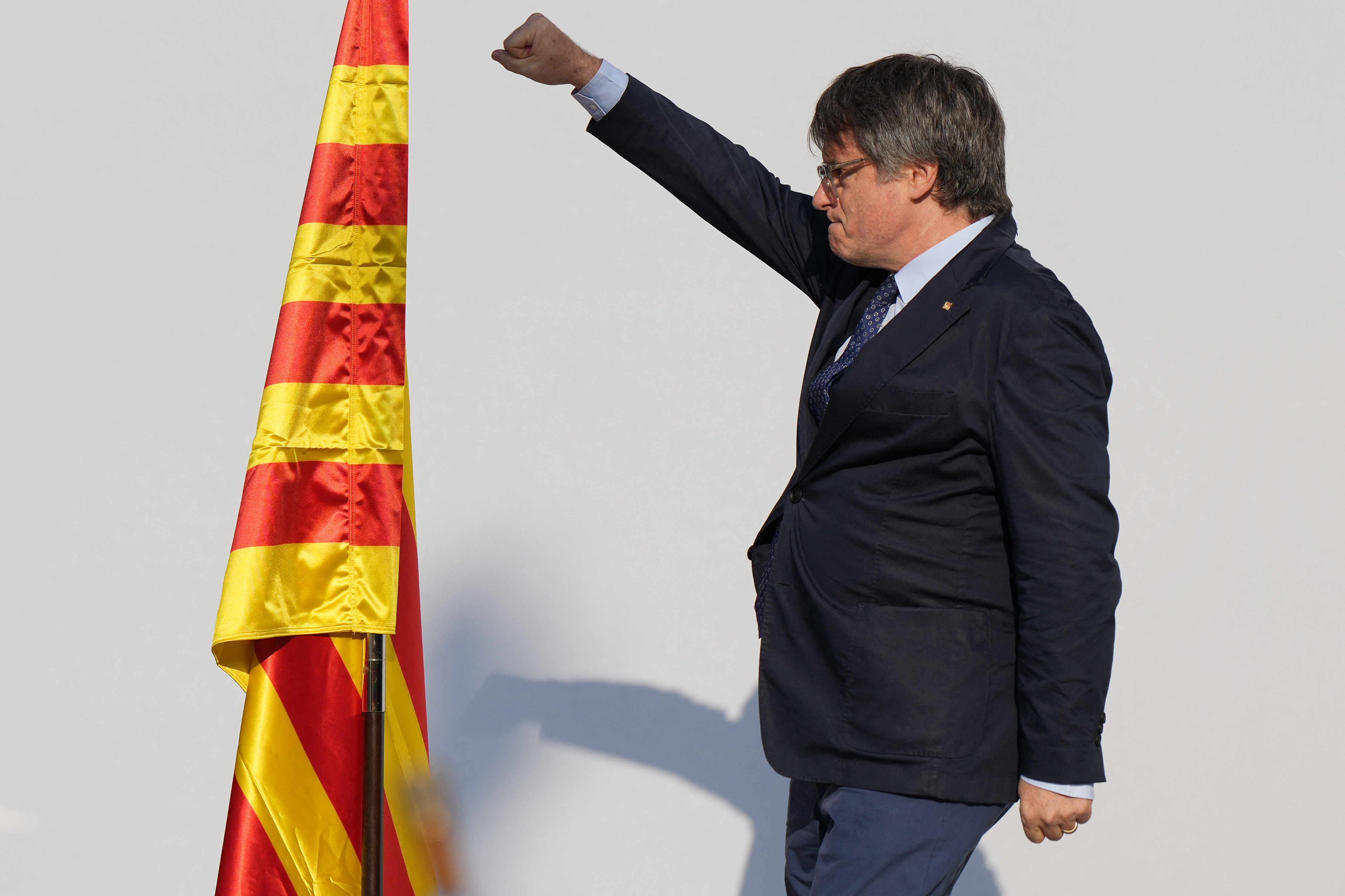 Catalonia's exiled separatist leader Carles Puigdemont arrives to deliver a speech on stage as his hardline separatist