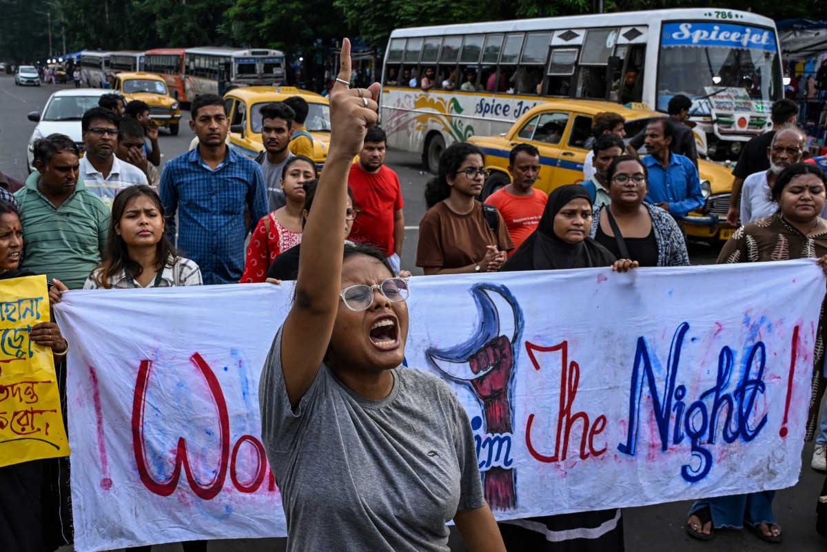 Activists shout slogans during a protest to condemn the rape and murder of a doctor in India's West Bengal state, in Kolkata on August 25. Doctors at a top Indian government hospital ended a nearly two-week strike but demonstrations continued in Kolkata [Dibyangshu Sarkar/AFP]