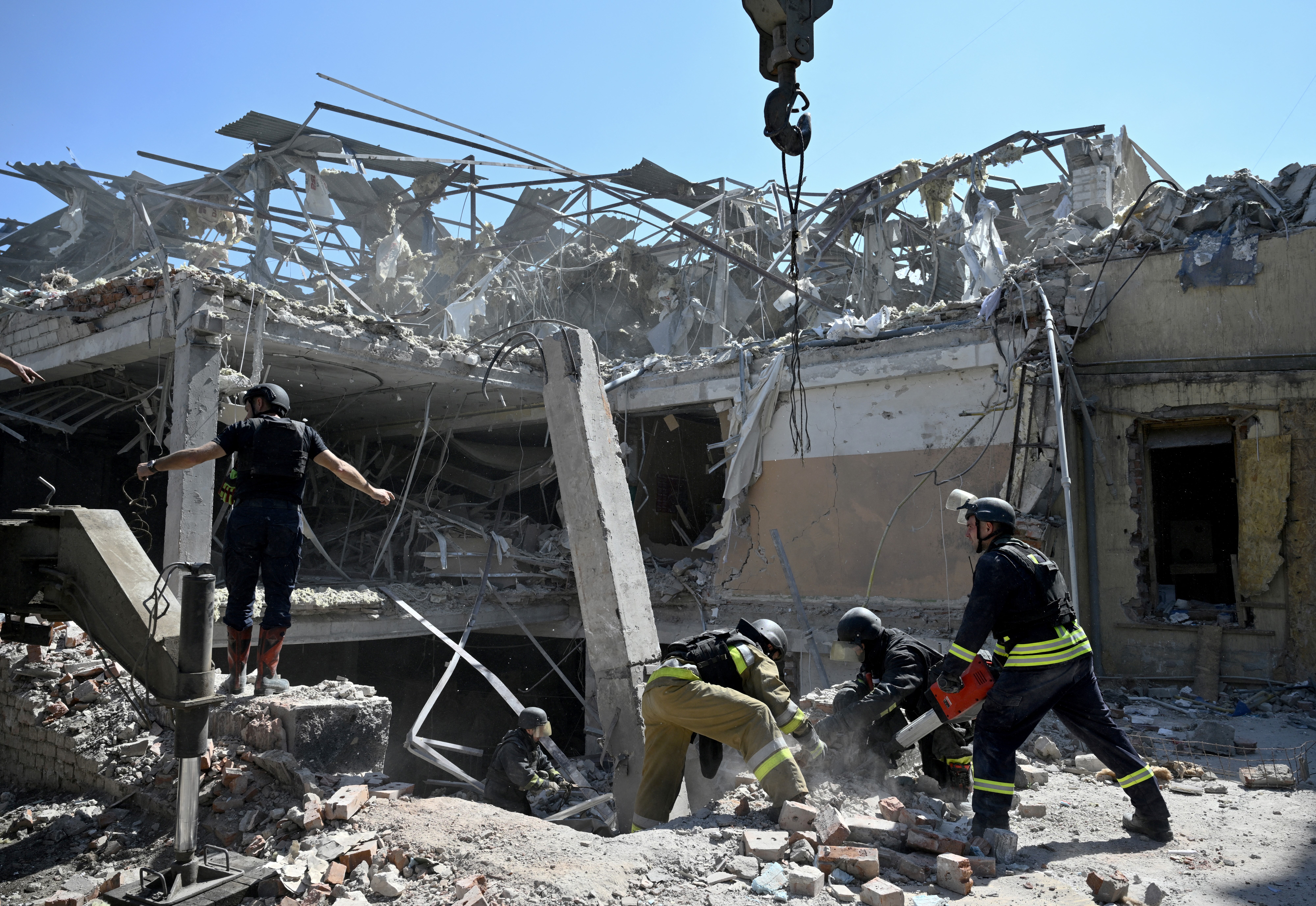 The ruined hotel after the Russian attack. Rescue workers are trying to move the rubble and concrete