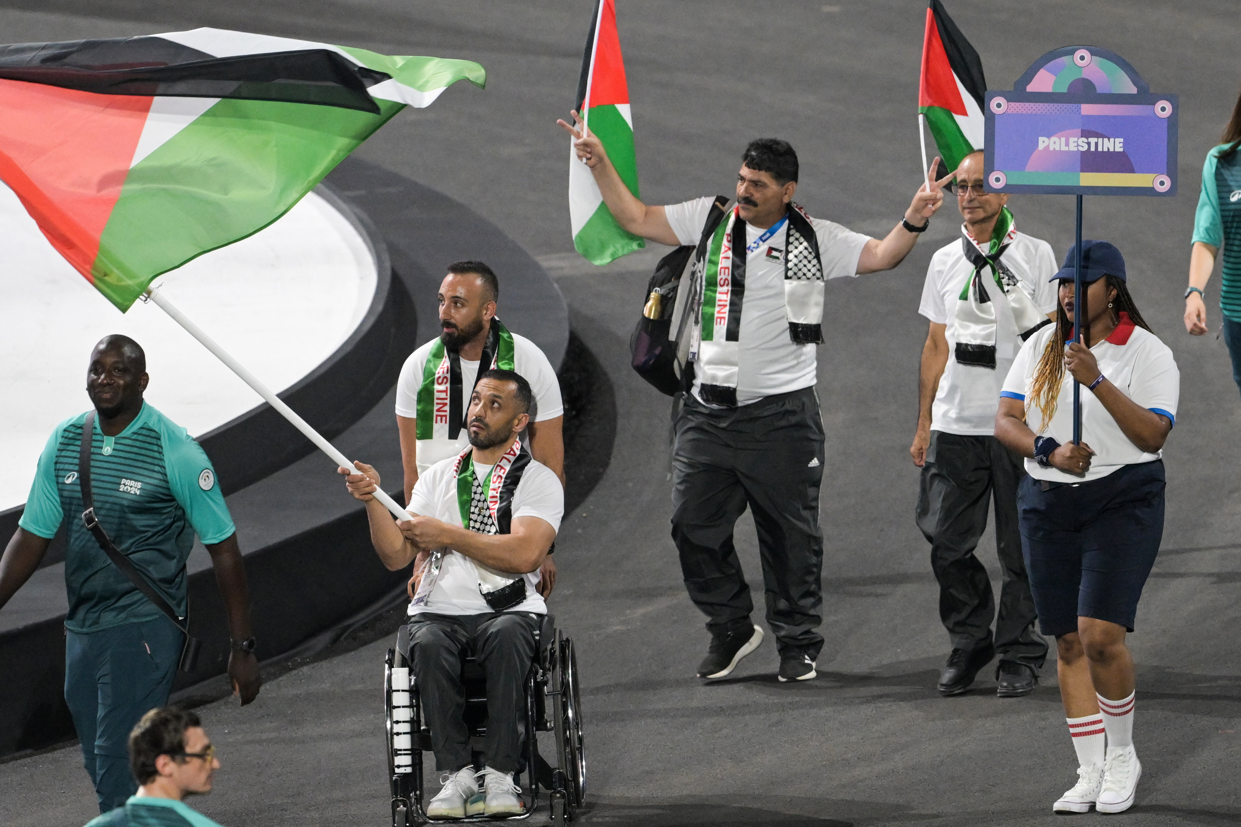 Palestine's delegation arrives during the Parade of Nations as part of the Paris 2024 Paralympic Games Opening Ceremony at the Place de la Concorde in Paris on August 28, 2024. (Photo by Bertrand GUAY / AFP)