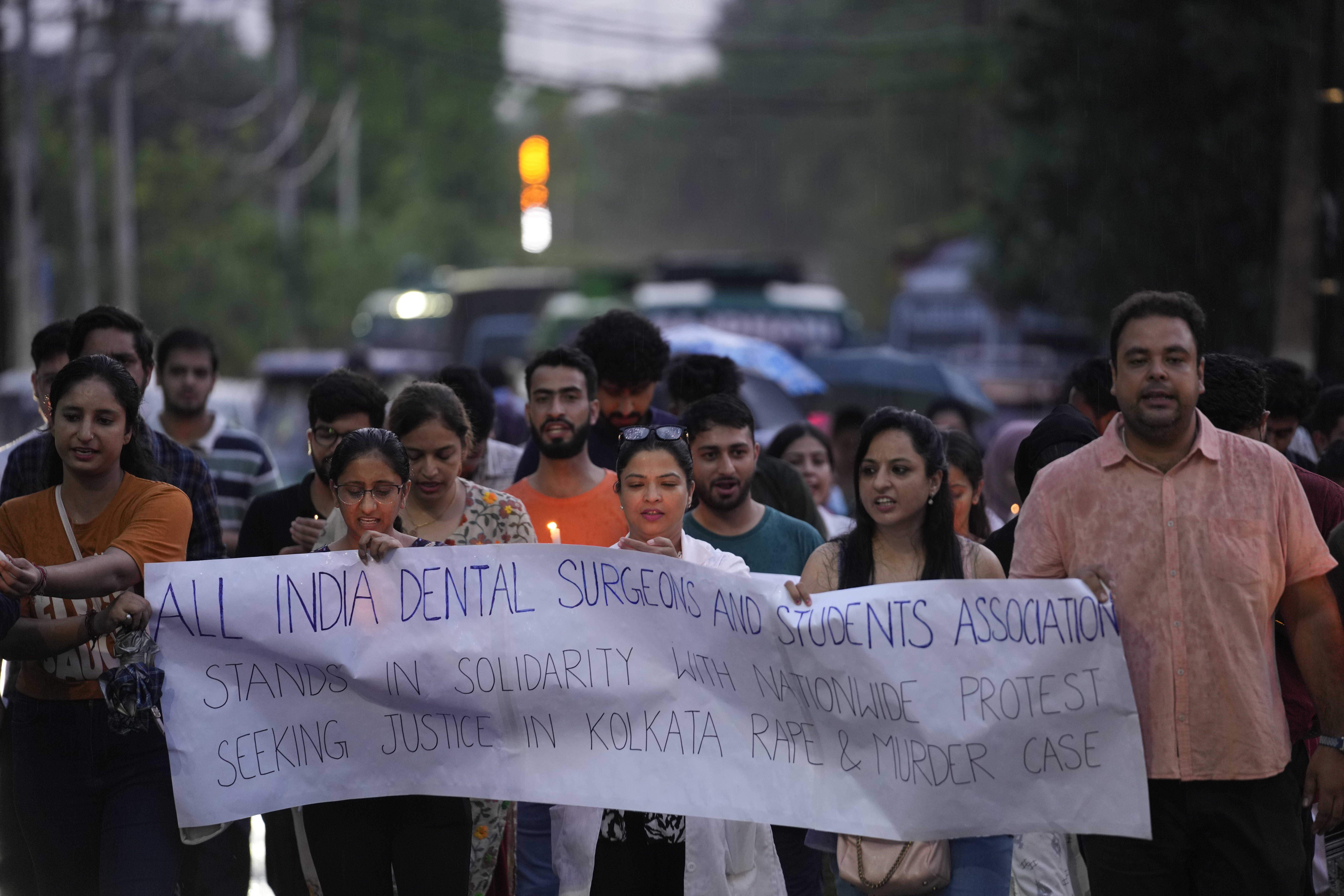 All india Dental medical students light candles march as they protest against the rape and killing of a trainee doctor at a government hospital last week, in Jammu, India, Saturday, Aug. 17, 2024. (AP Photo/Channi Anand)