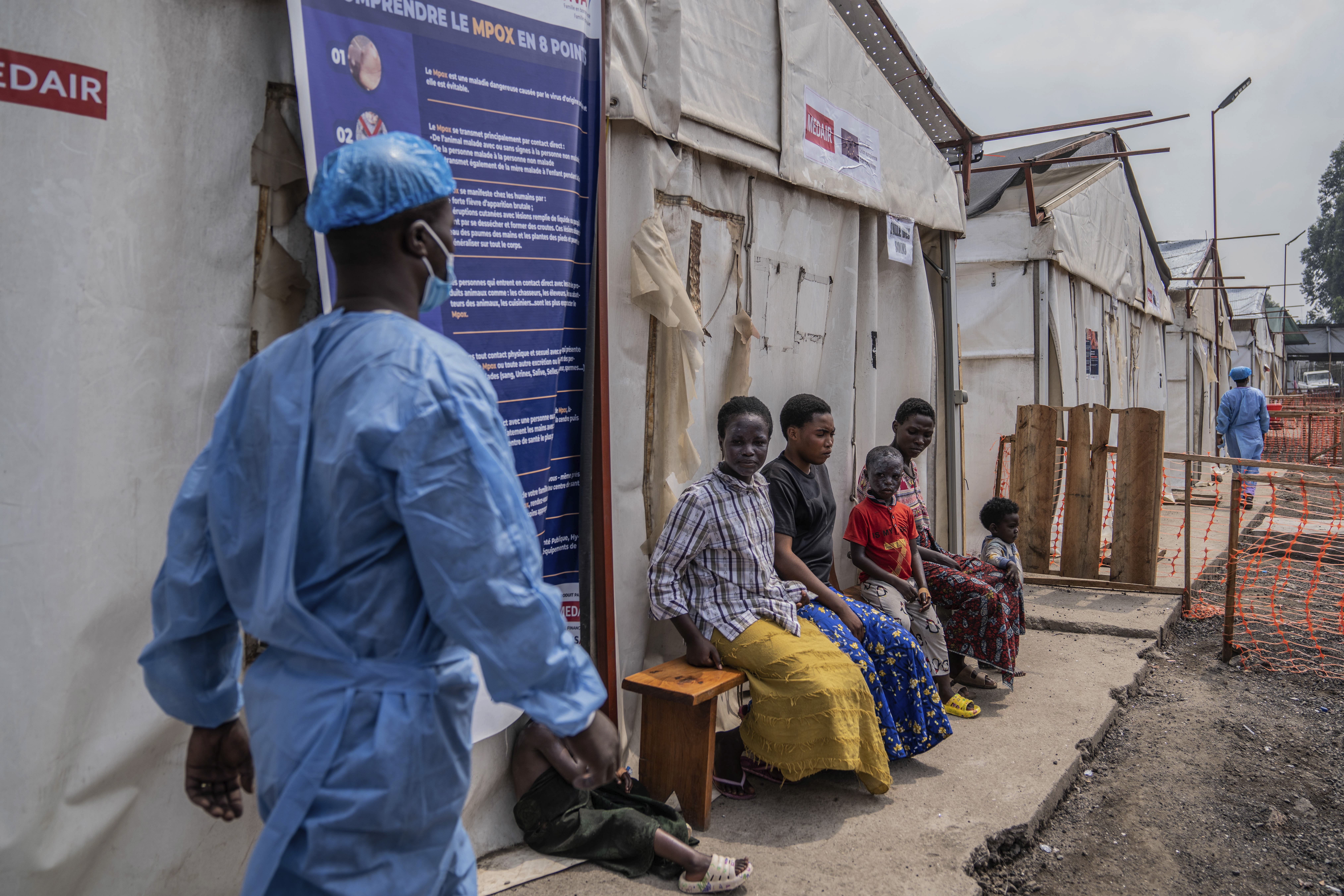 Children wait at a health-pox clinic in DRC