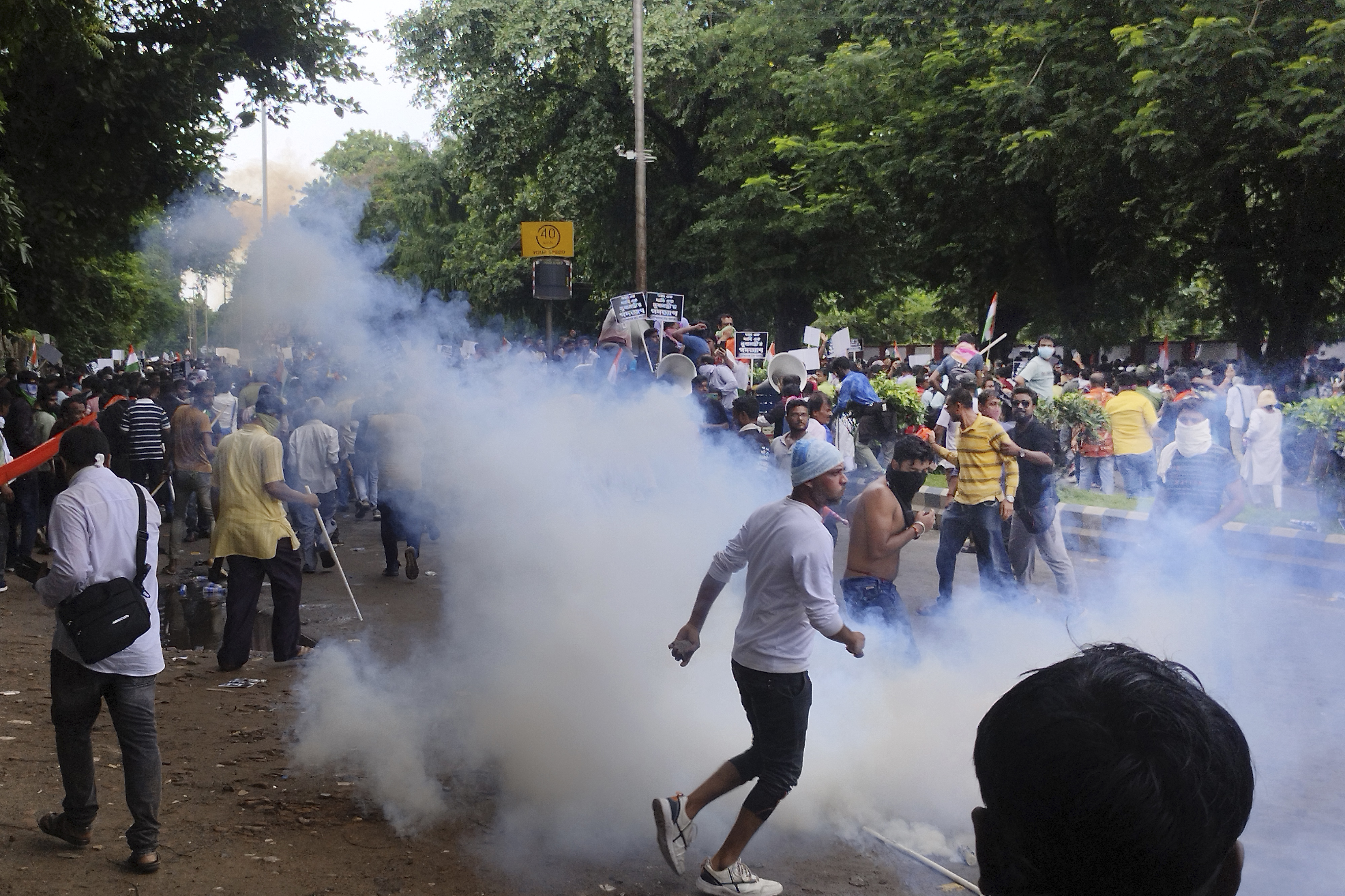 Police fire tear gas shells to disperse people protesting against the rape and murder of a resident doctor at a government hospital earlier this month