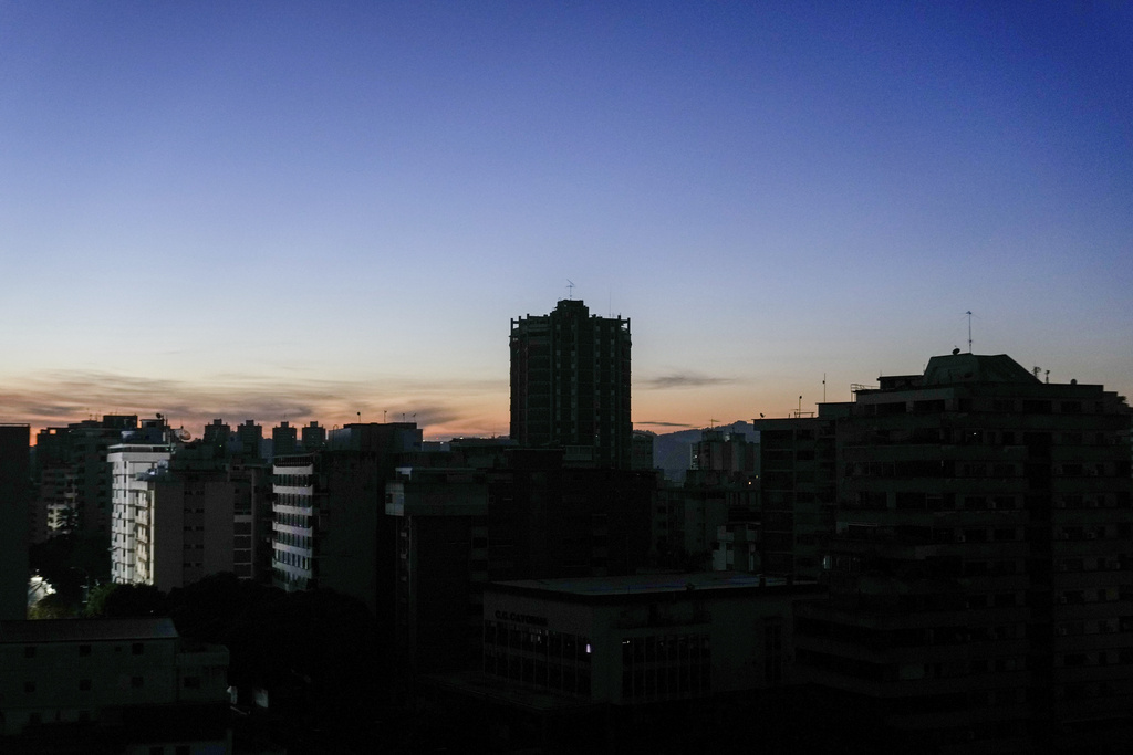 Buildings stand in darkness during a power outage in Caracas, Venezuela
