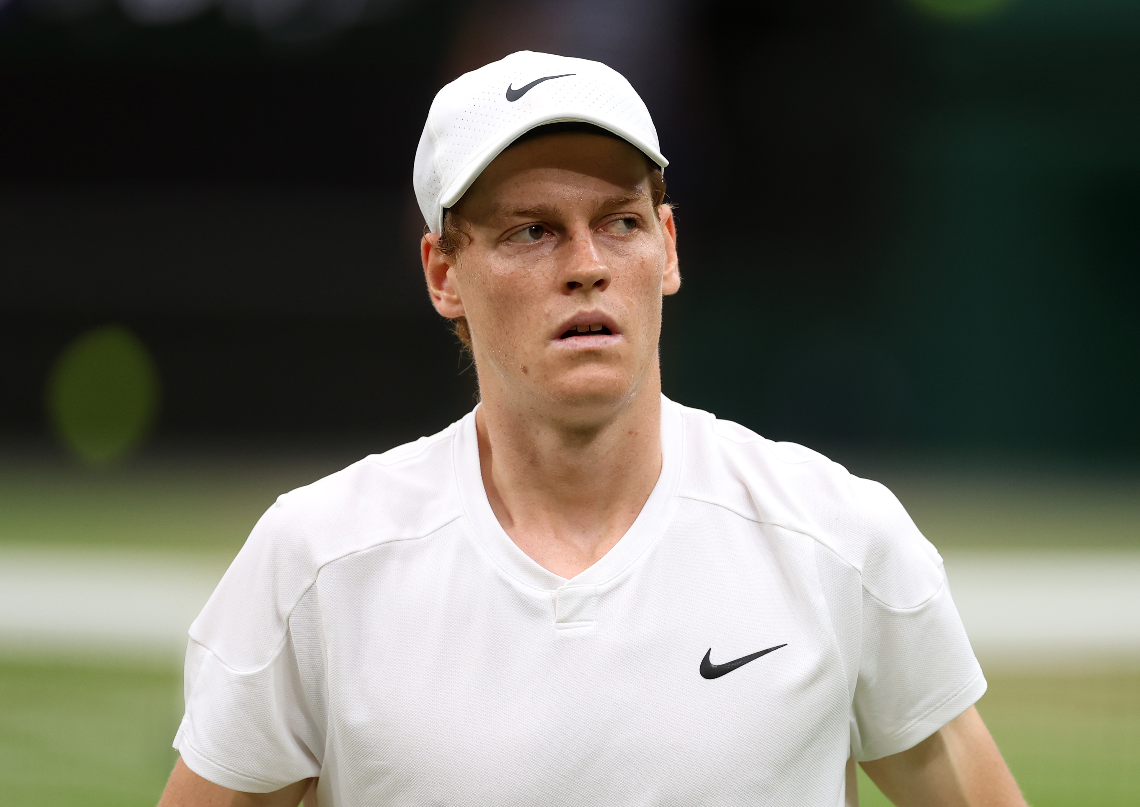 Tennis player Jannik Sinner on court.