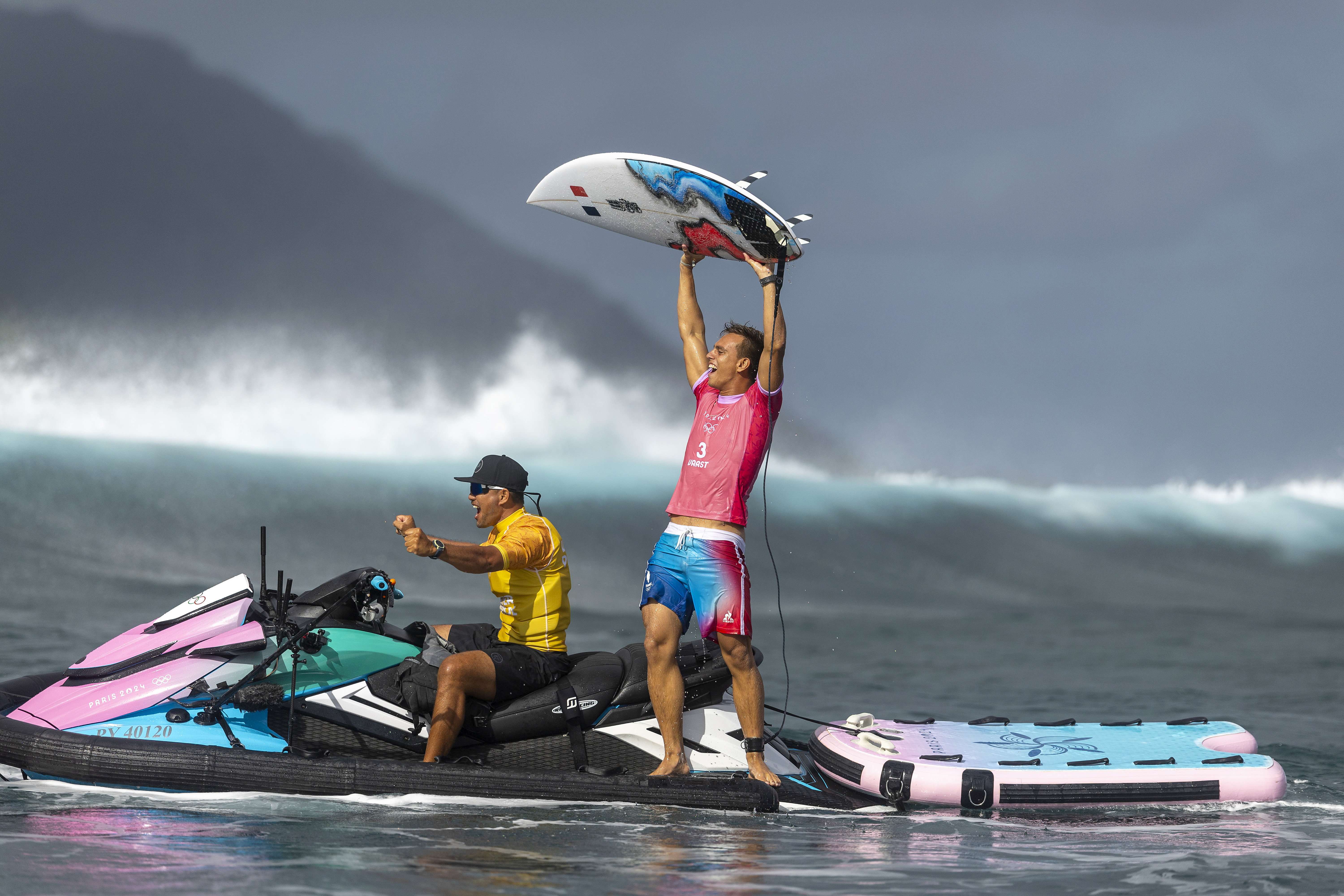 Surfer celebrates win.