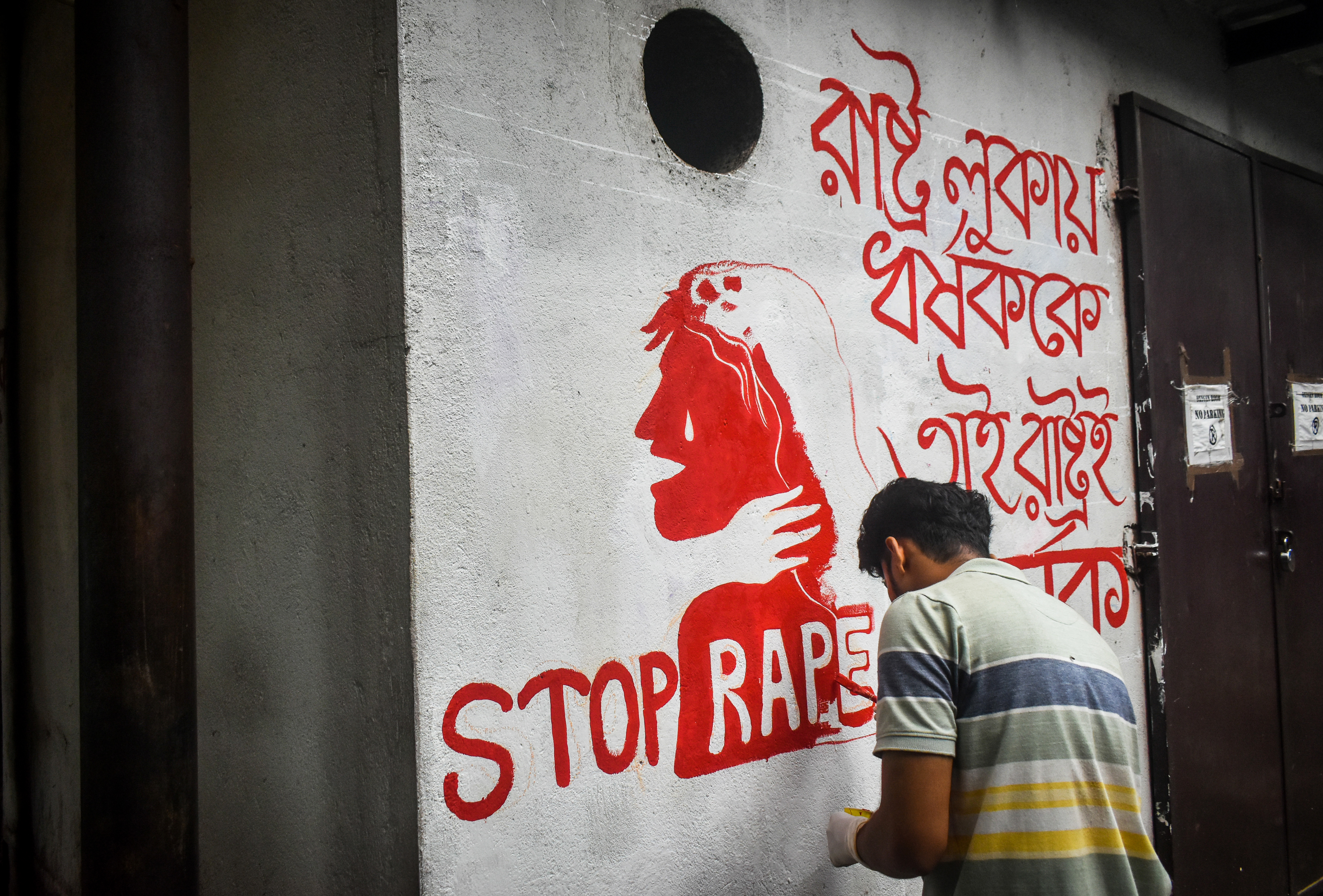 A doctor paints a mural with slogans inside R G Kar Medical College and Hospital campus condemning the rape and murder of a trainee medic at a government-run hospital, in Kolkata, India, on August 25, 2024. (Photo by Sudipta Das/NurPhoto via Getty Images)
