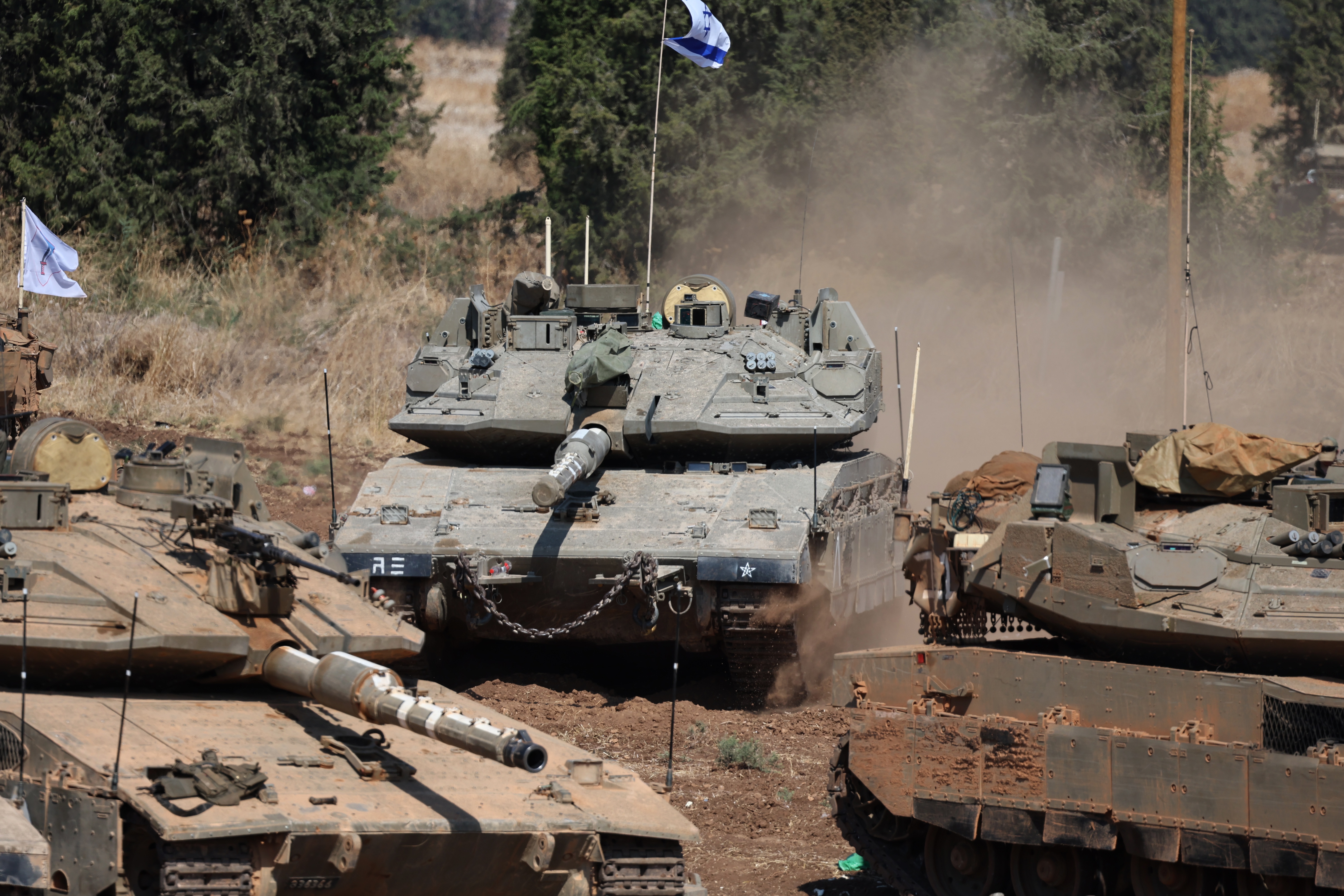 Israeli military vehicles at a gathering site