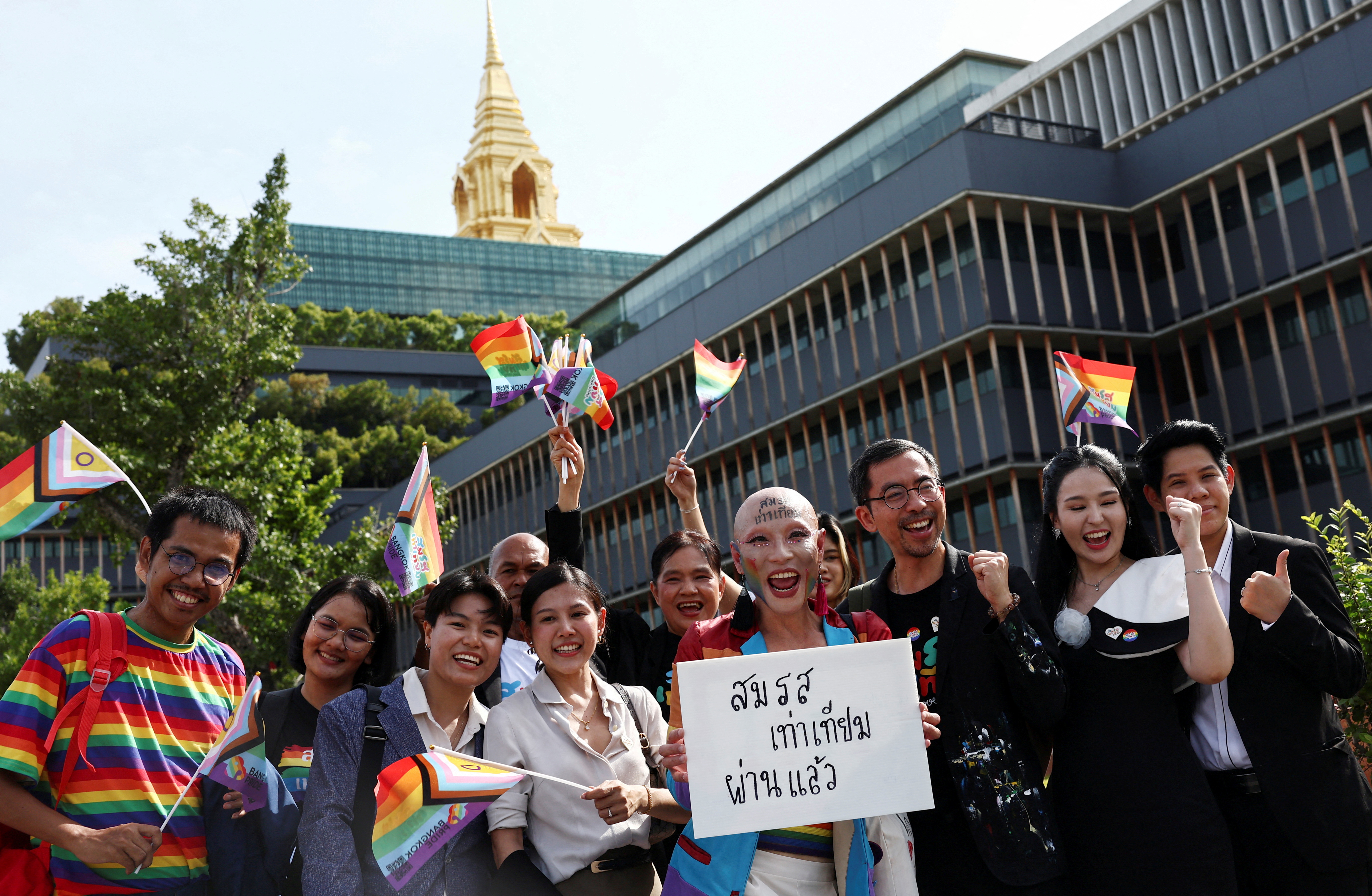 Members of the LGBTQ+ community celebrate after the passing of the marriage equality bill in its second and third readings by the Senate in Bangkok, Thailand, June 18, 2024.